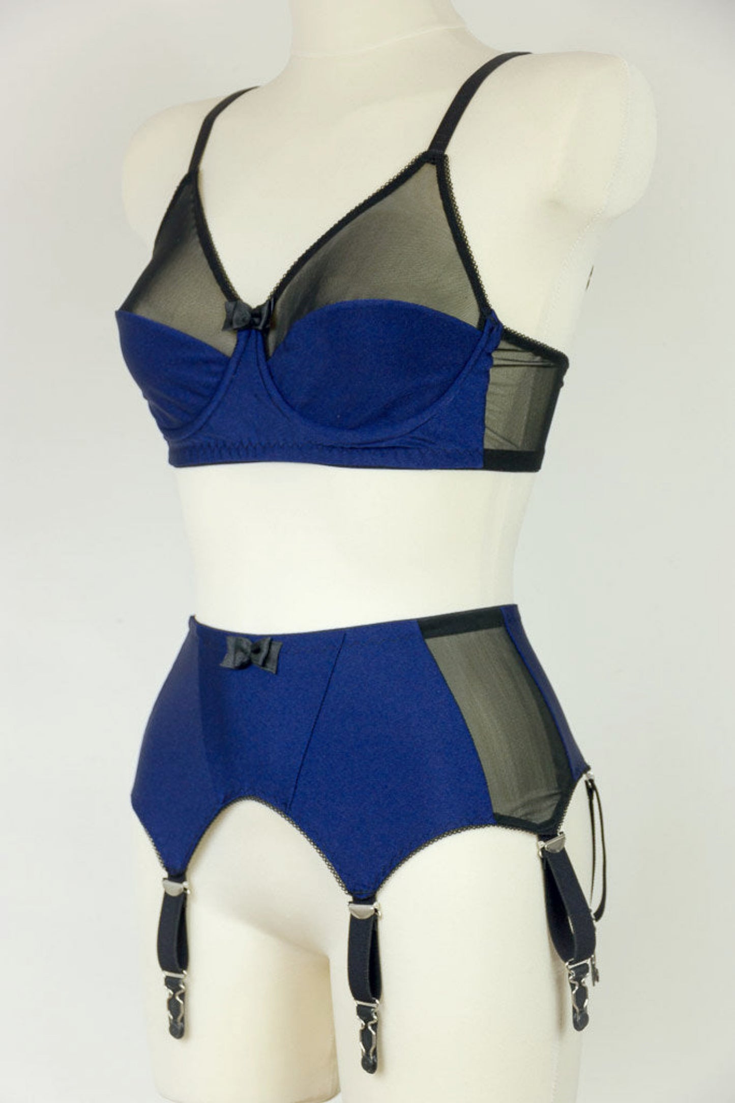 blue Audrey bra with black sheer the upper part of the cup, with matching garter belt