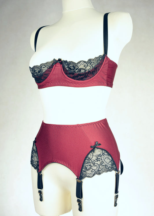 dark red retro style, 6 strap Scarlett garter belt with black straps and lace side inserts, shown with matching Lucy quarter cup bra