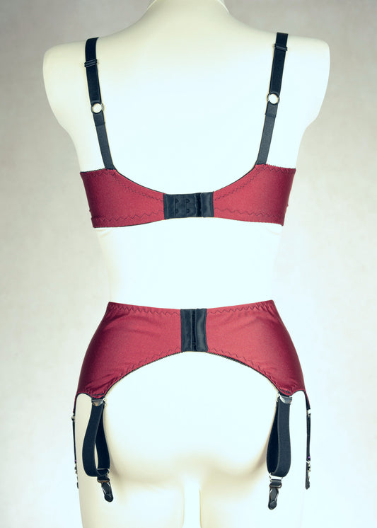 dark red retro style, 6 strap Scarlett garter belt with black straps and lace side inserts, shown with matching Lucy quarter cup bra, back view