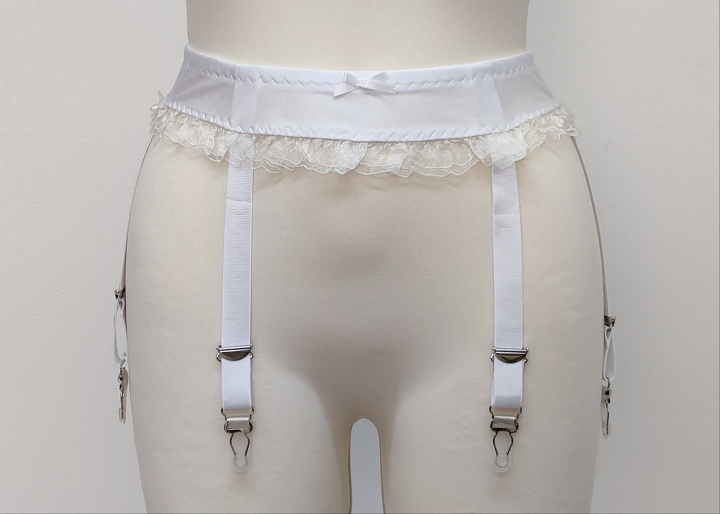 white narrow 60's style Summer garter belt with ruffle trim and 6 straps