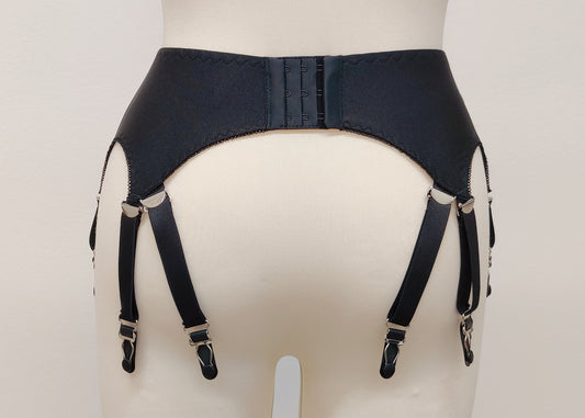 A black Nina garter belt with additional straps attached to the back