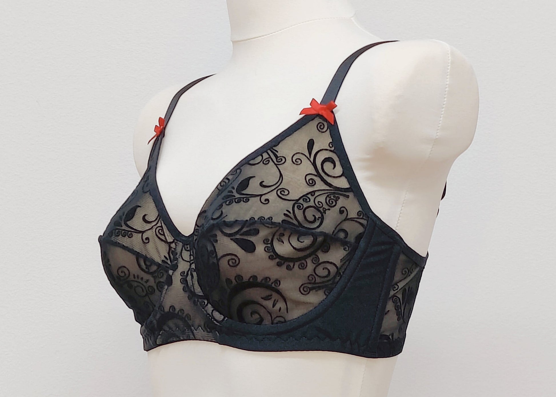 black flocked velvet mesh full cup bra, with red satin bows, size US 36C, side view