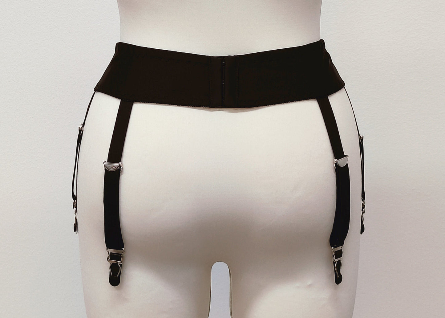 black narrow 60's style Summer garter belt with 6 straps, back view