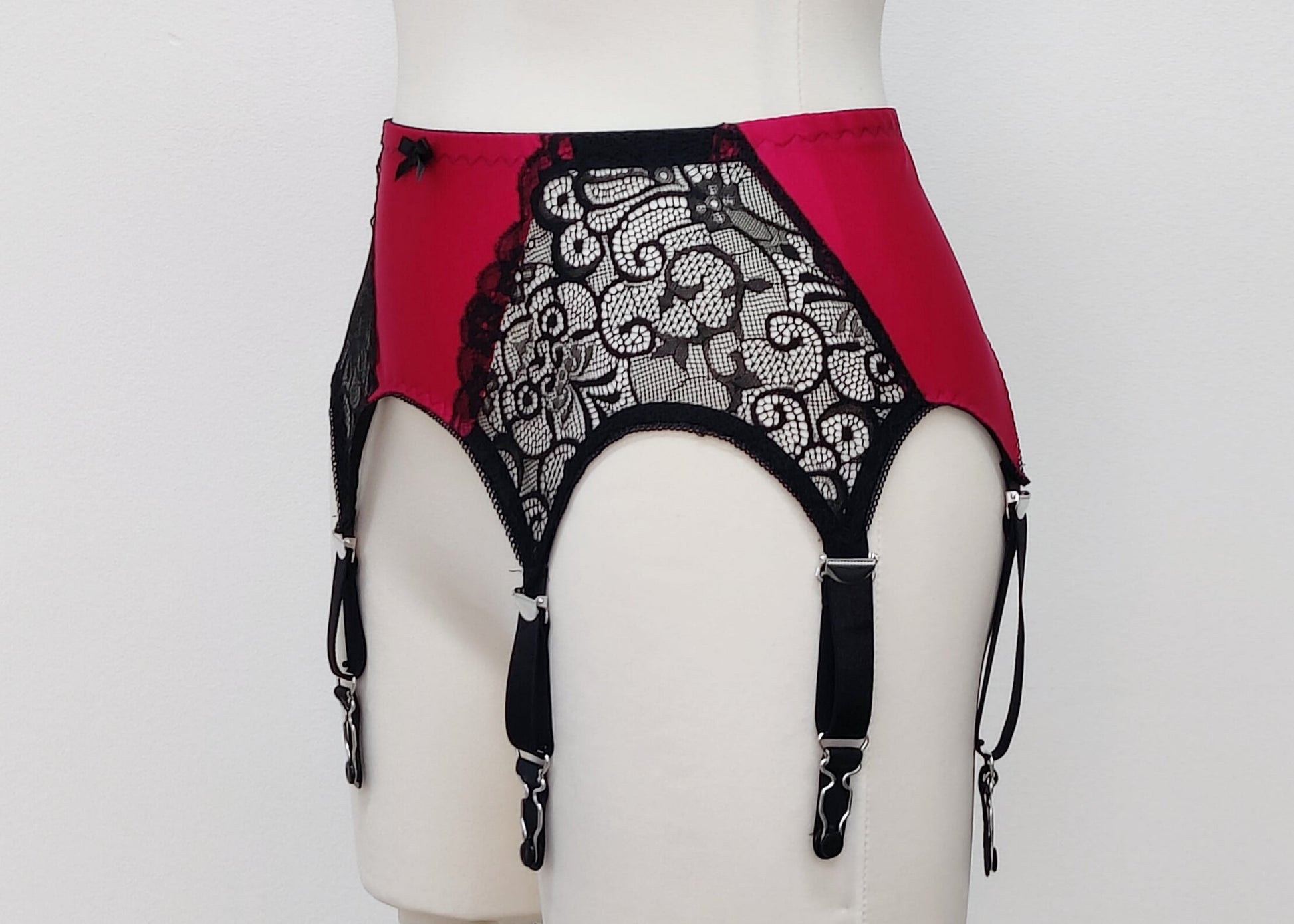 Magenta with black lace and straps, 6 strap Mona retro style garter belt, side view
