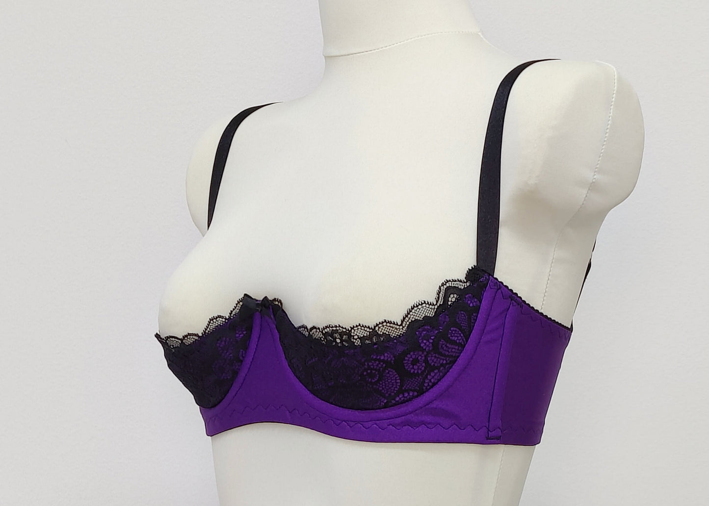 Purple LUCY Quarter cup bra with black lace and straps, size US 34C or EU 75C, side view