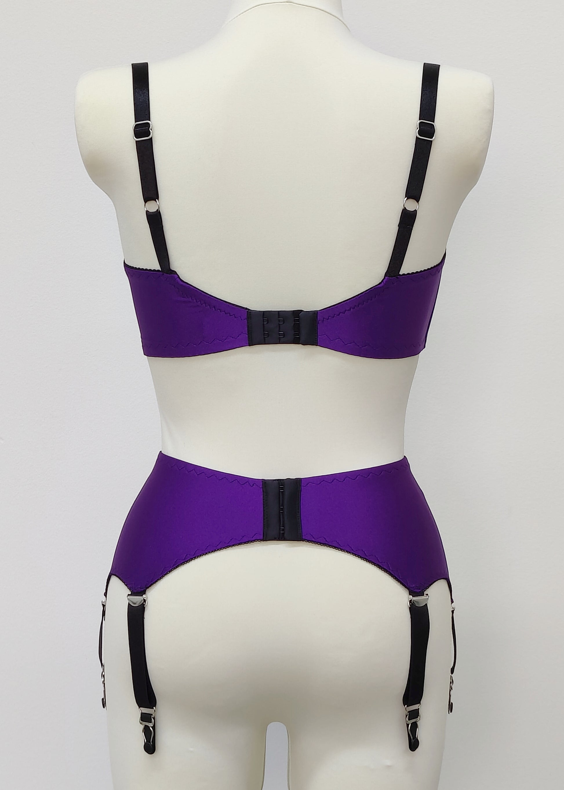 purple 6 strap Scarlett garter belt with black straps and lace side inserts, shown with matching bra, back view