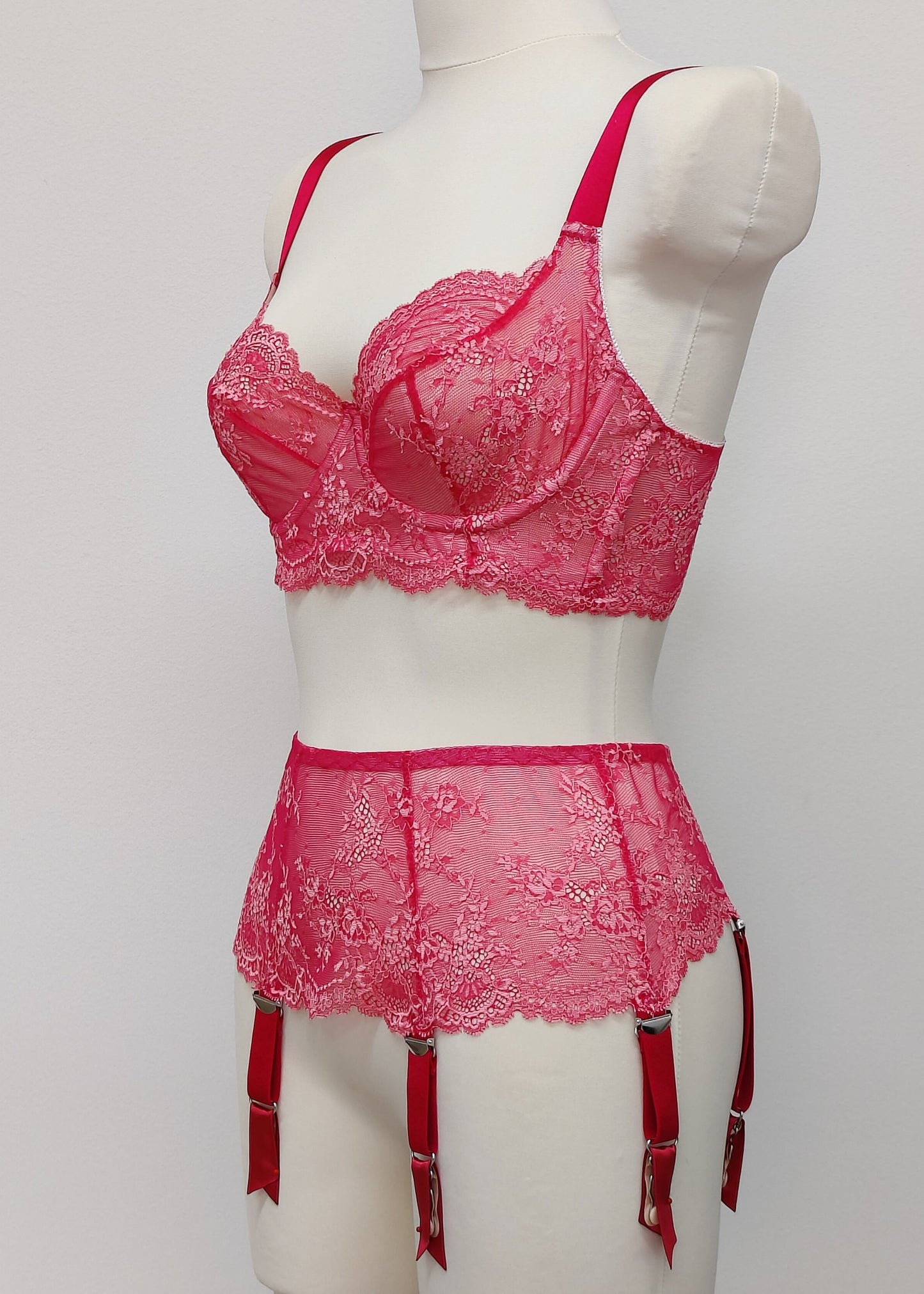 hot pink lace Judith garter belt with 6 straps, shown with matching bra, side view