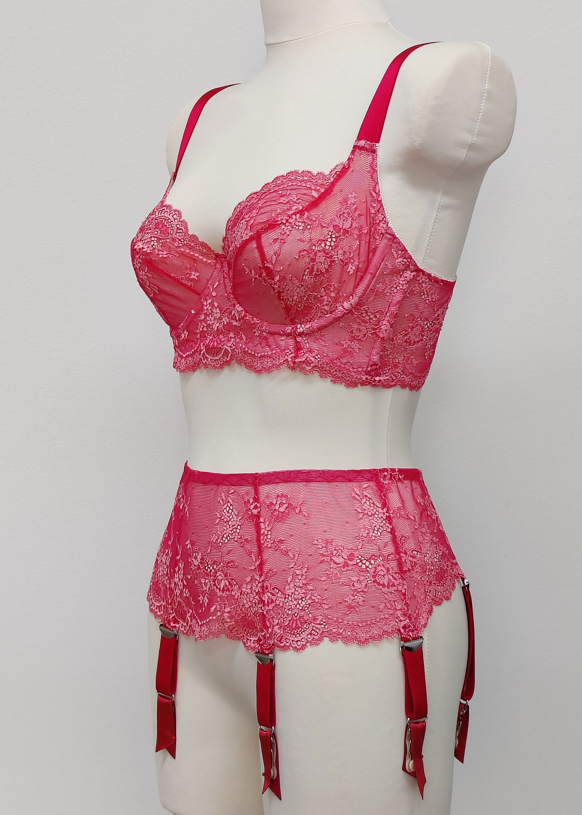 hot pink lace Judith garter belt with 6 straps, shown with matching bra, side view