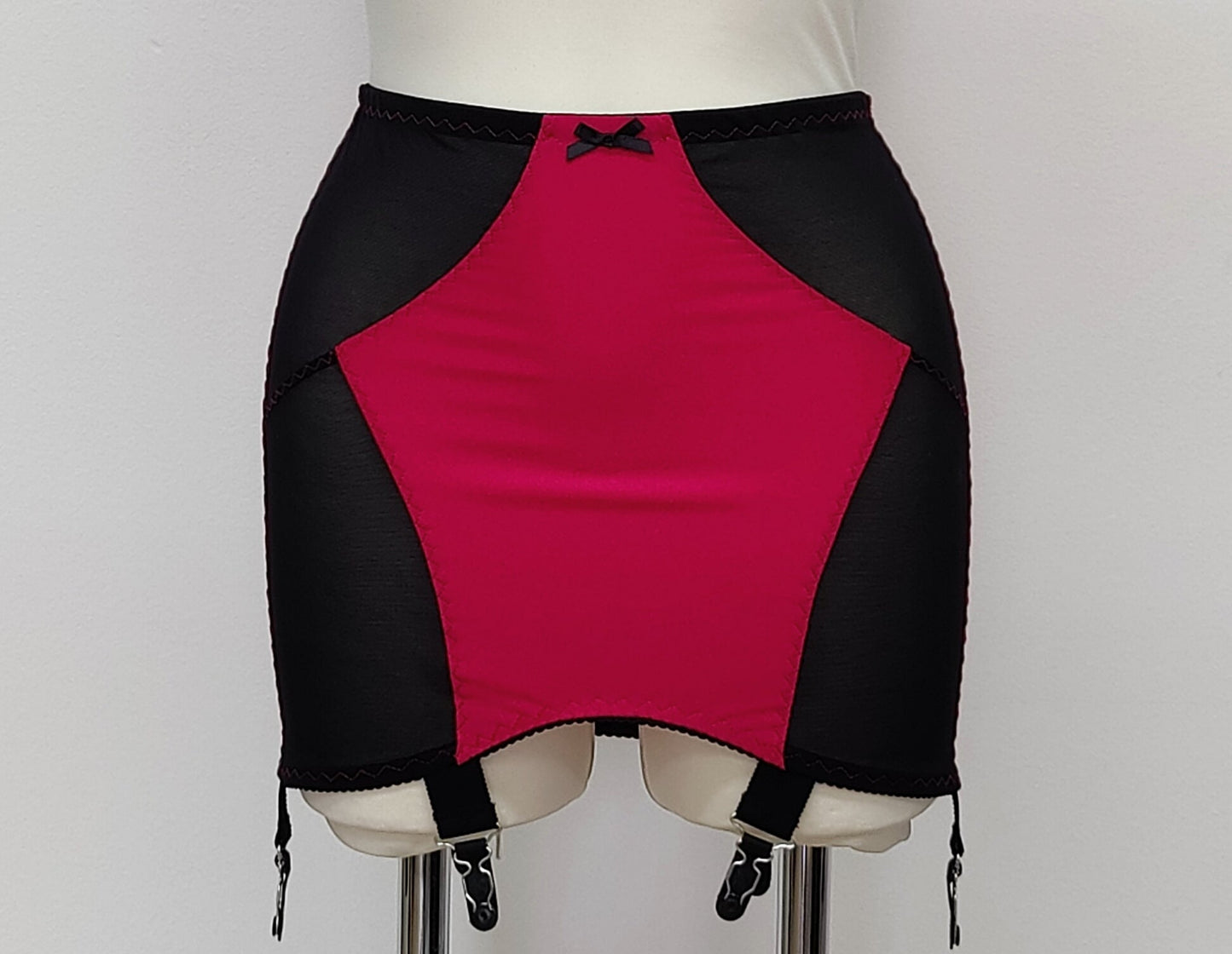 magenta with black Open bottom Glenda girdle made with opaque front and back panels with sheer power mesh side panels.