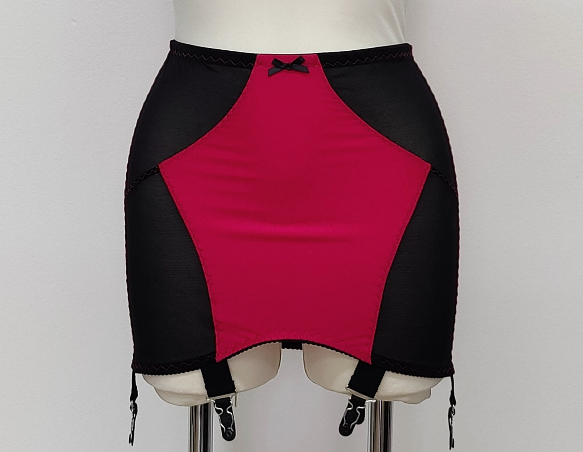 magenta with black Open bottom Glenda girdle made with opaque front and back panels with sheer power mesh side panels.