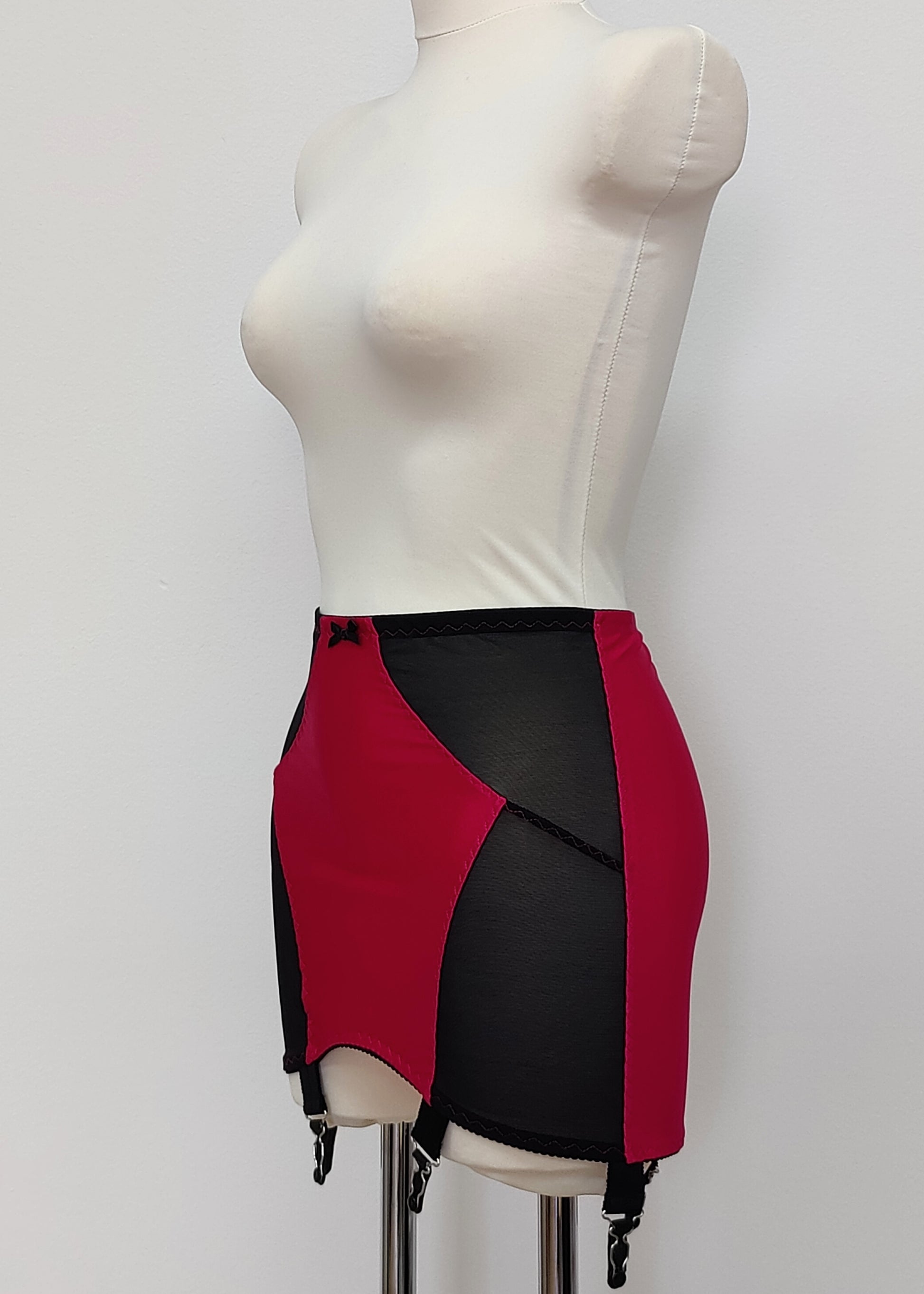 magenta with black Open bottom Glenda girdle made with opaque front and back panels with sheer power mesh side panels.