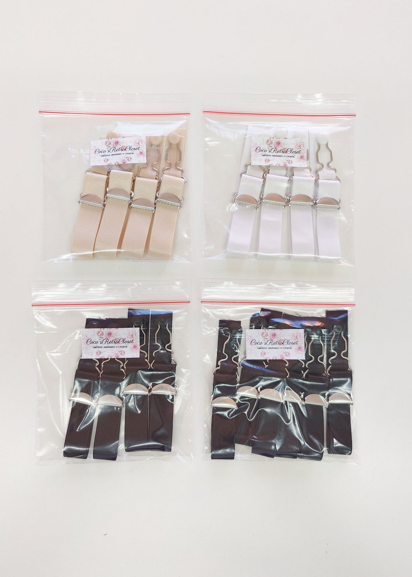 black, white and beige garter straps, suspender straps in packages