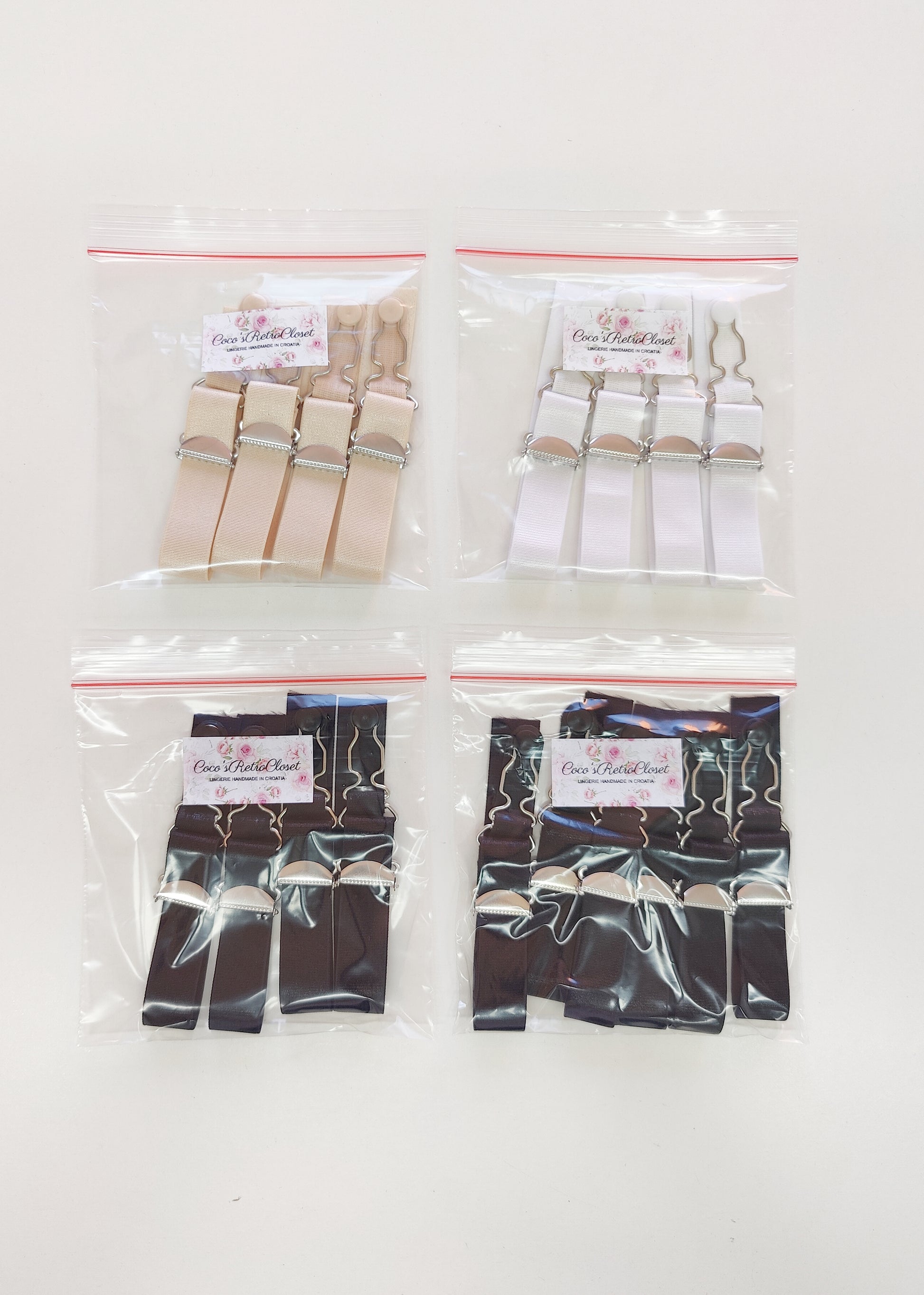 black, white and beige garter straps, suspender straps in packages