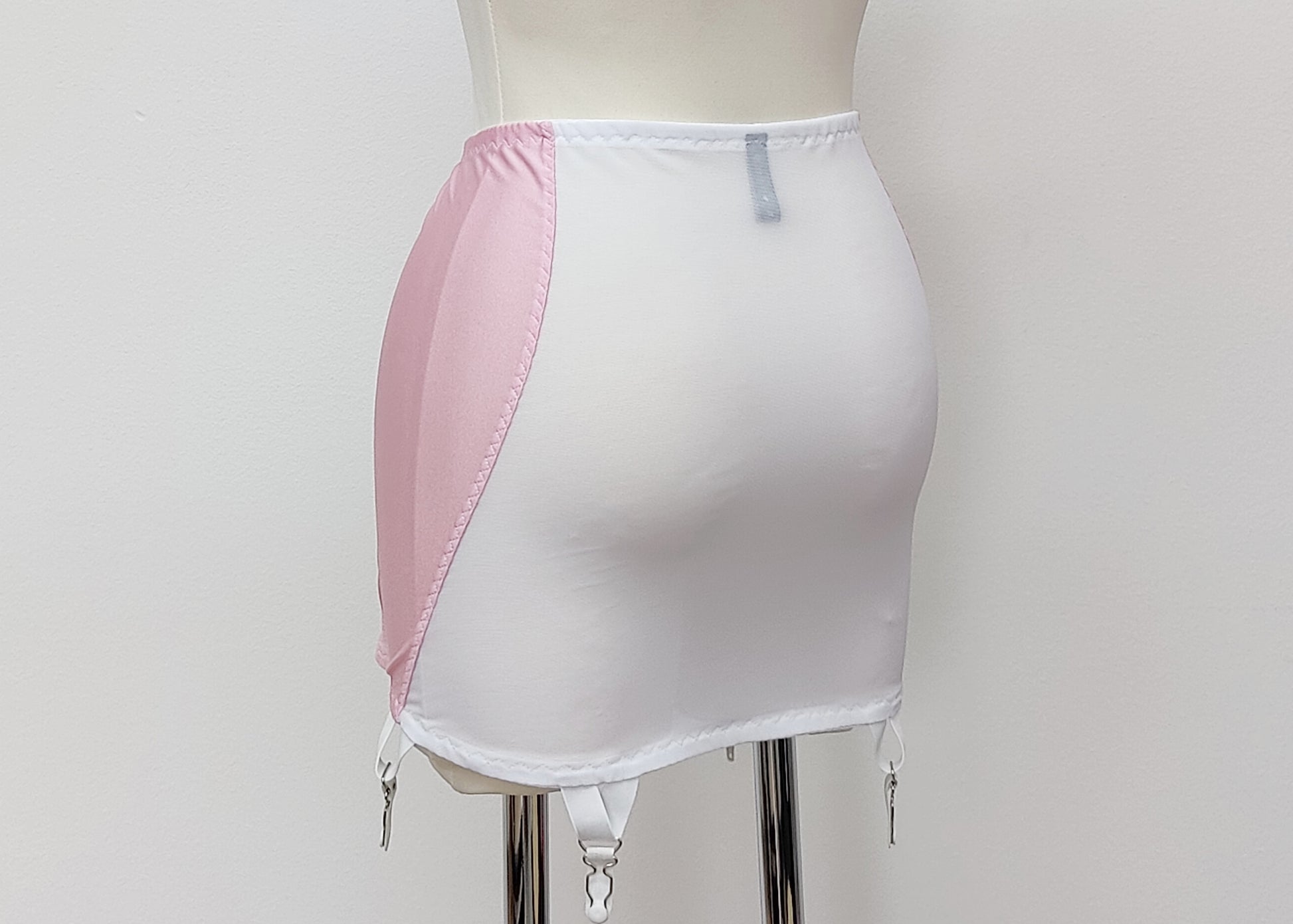 pink 6 strap Rhonda open bottom girdle, with pink lace trim on the front and white sheer back