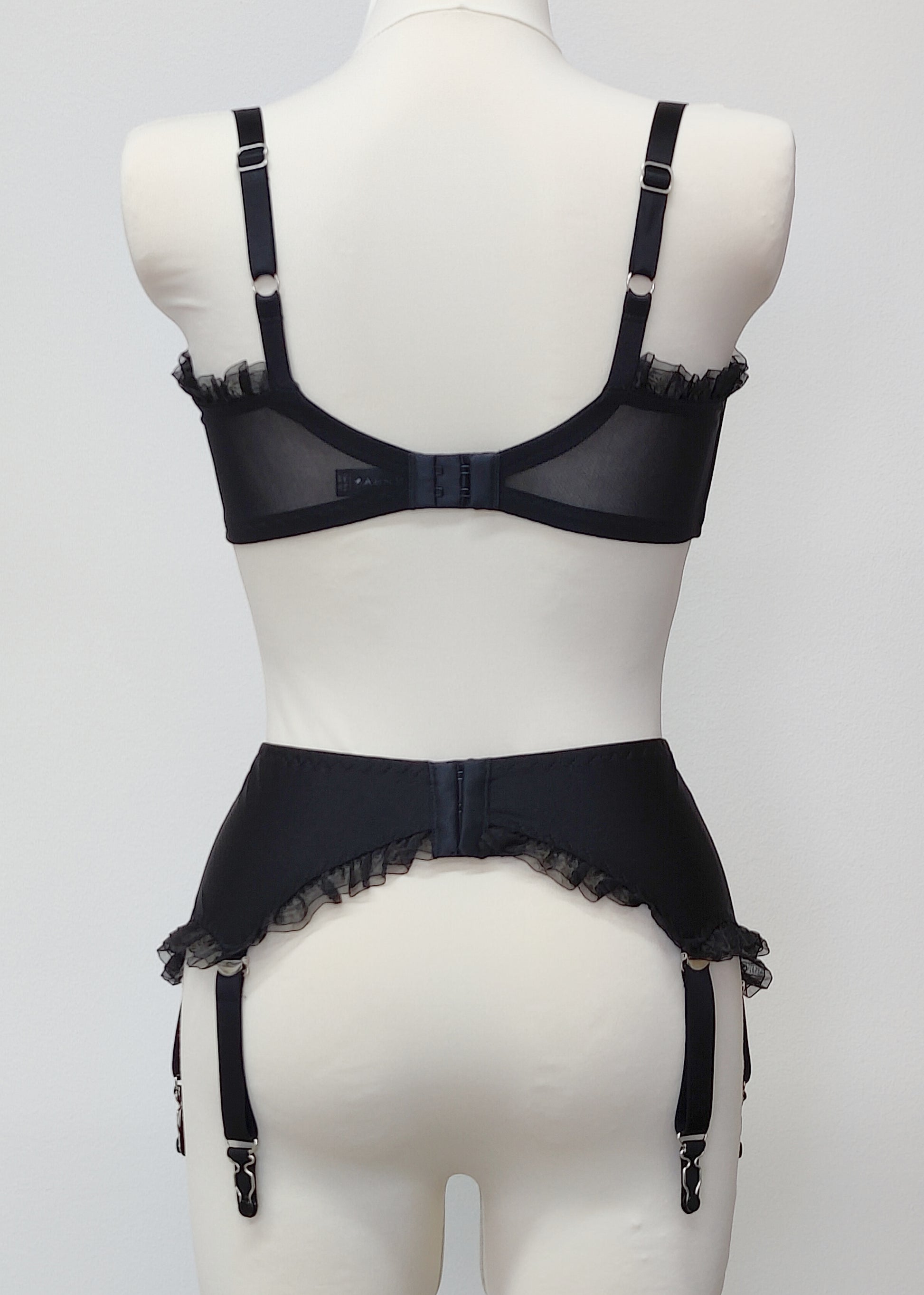 black 6 strap Gigi garter belt with ruffle trim, back view