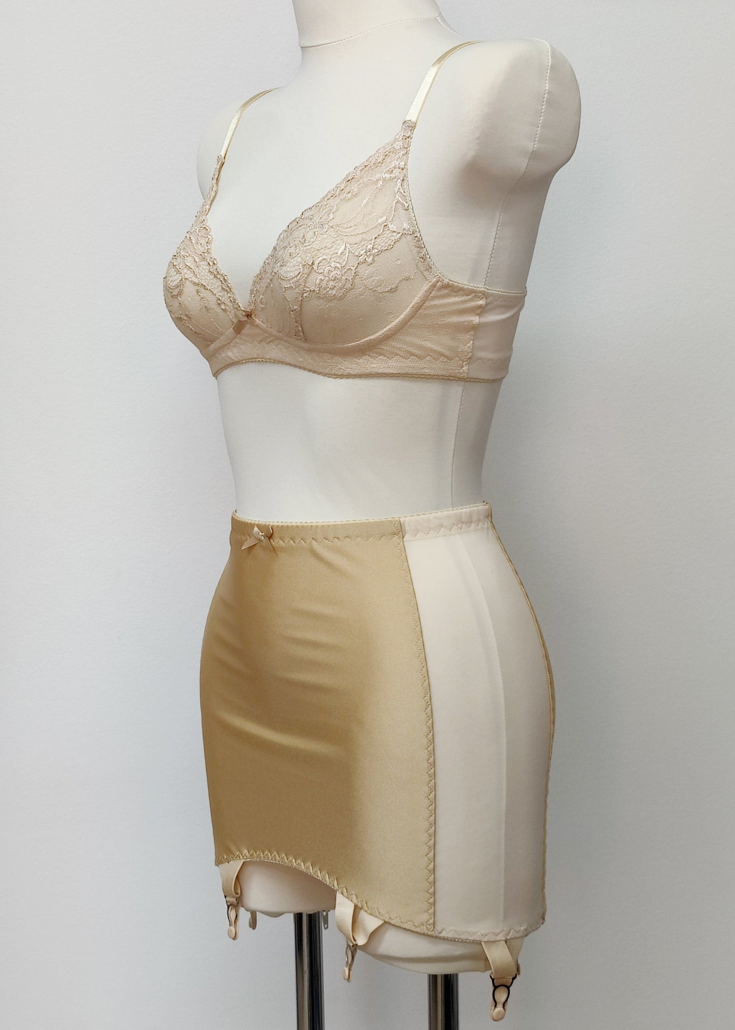Beige smooth, light control, pull on girdle made with spandex and power mesh side panels. With 6 v style non-adjustable straps. You can have solid color girdle or mix of colors for just your own different girdle. side view