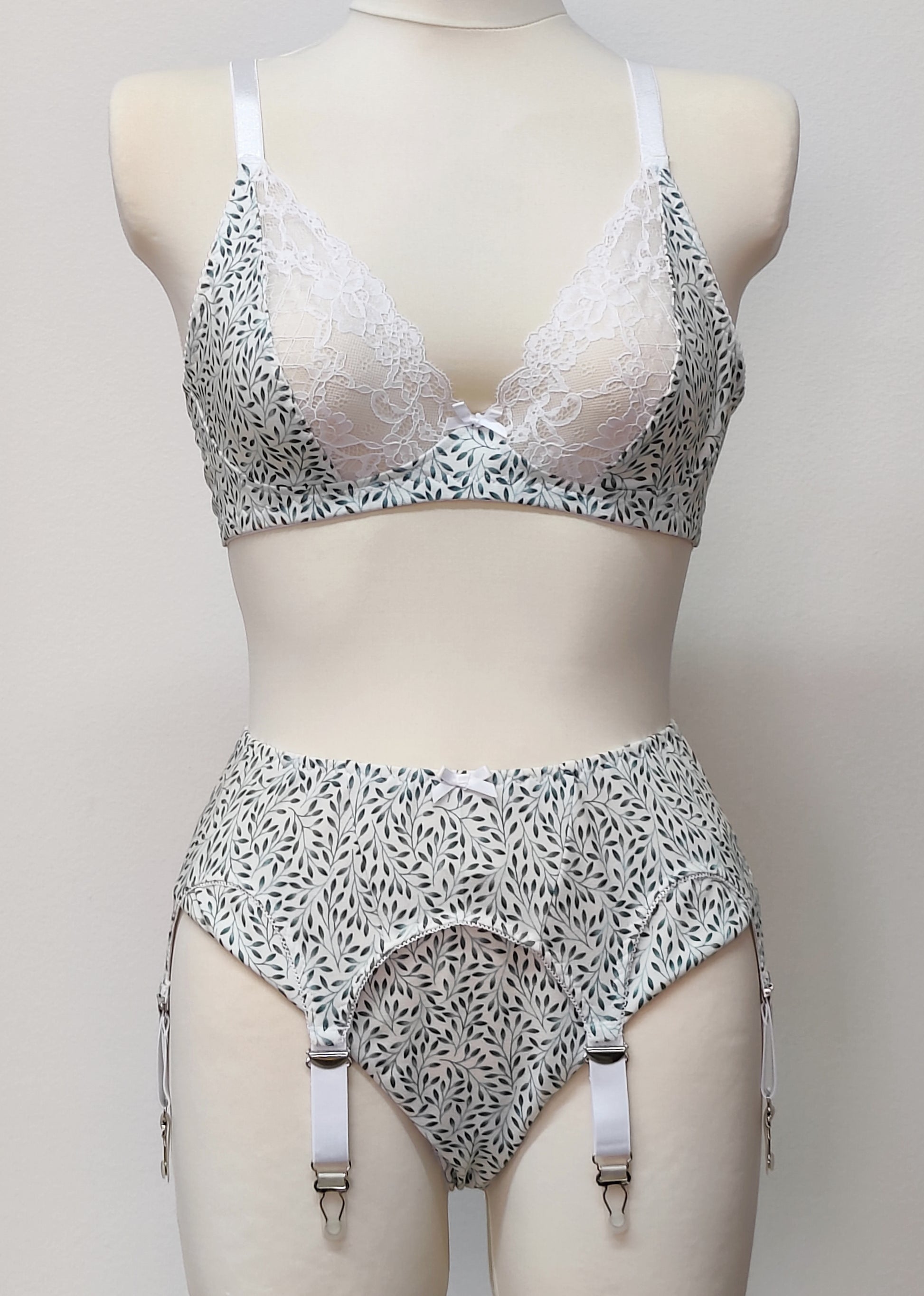 white cotton with tiny green leaves Mila bralette, with matching Ida panties and Etta garter belt
