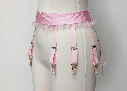 Pink narrow 60's style Summer garter belt with ruffle trim and here shown with 8 straps, side view