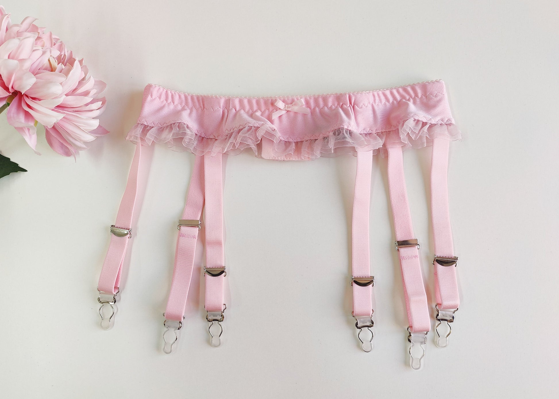 pink narrow 60's style, 6 strap garter belt with ruffle trim, size S