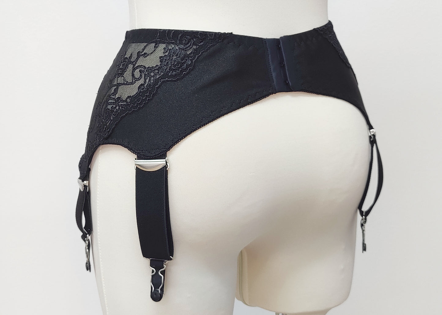 wide retro style Liliane garter belt with 6 extra wide straps and black lace side panels, back view