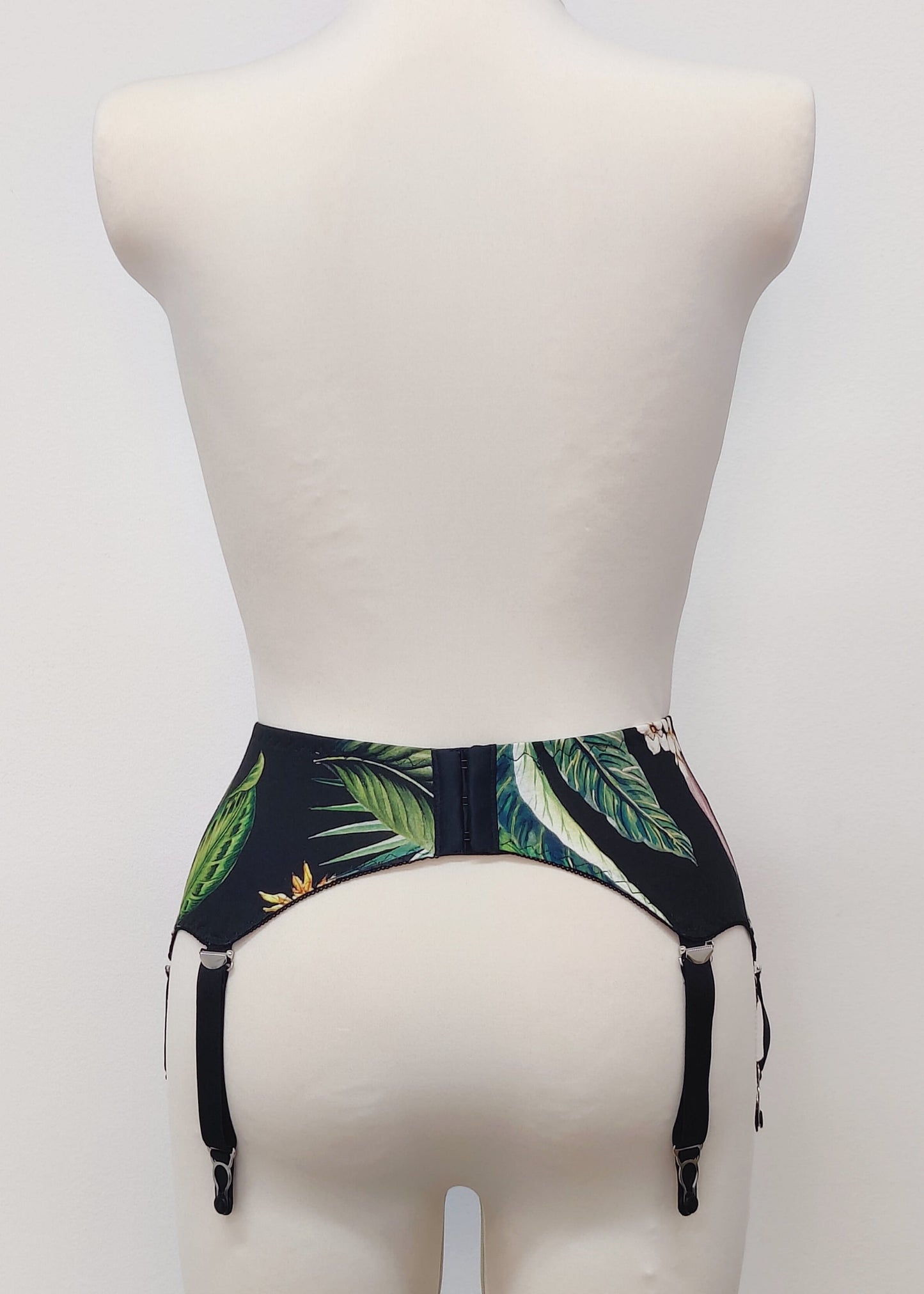 Veronica is classic retro style, 6 strap garter belt, tropical florals on black, back view