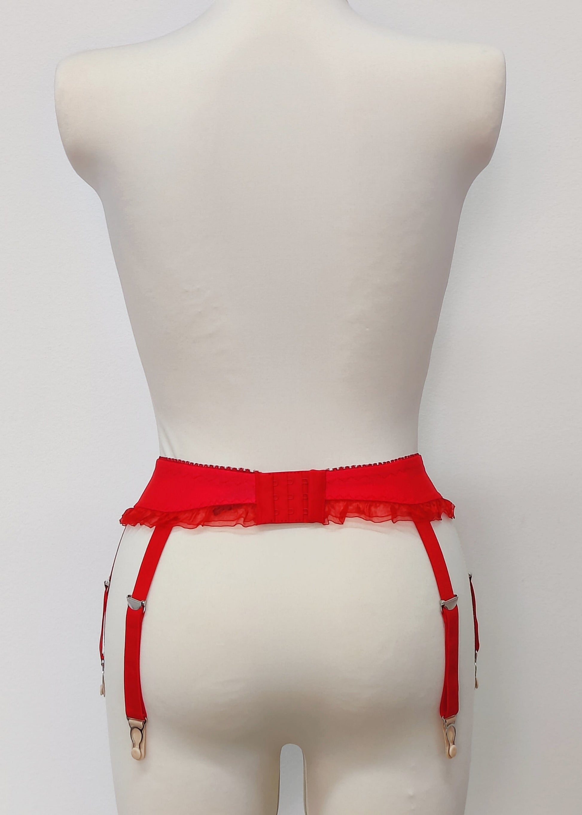 red narrow 60's style Summer garter belt with ruffle trim and 6 straps, back view