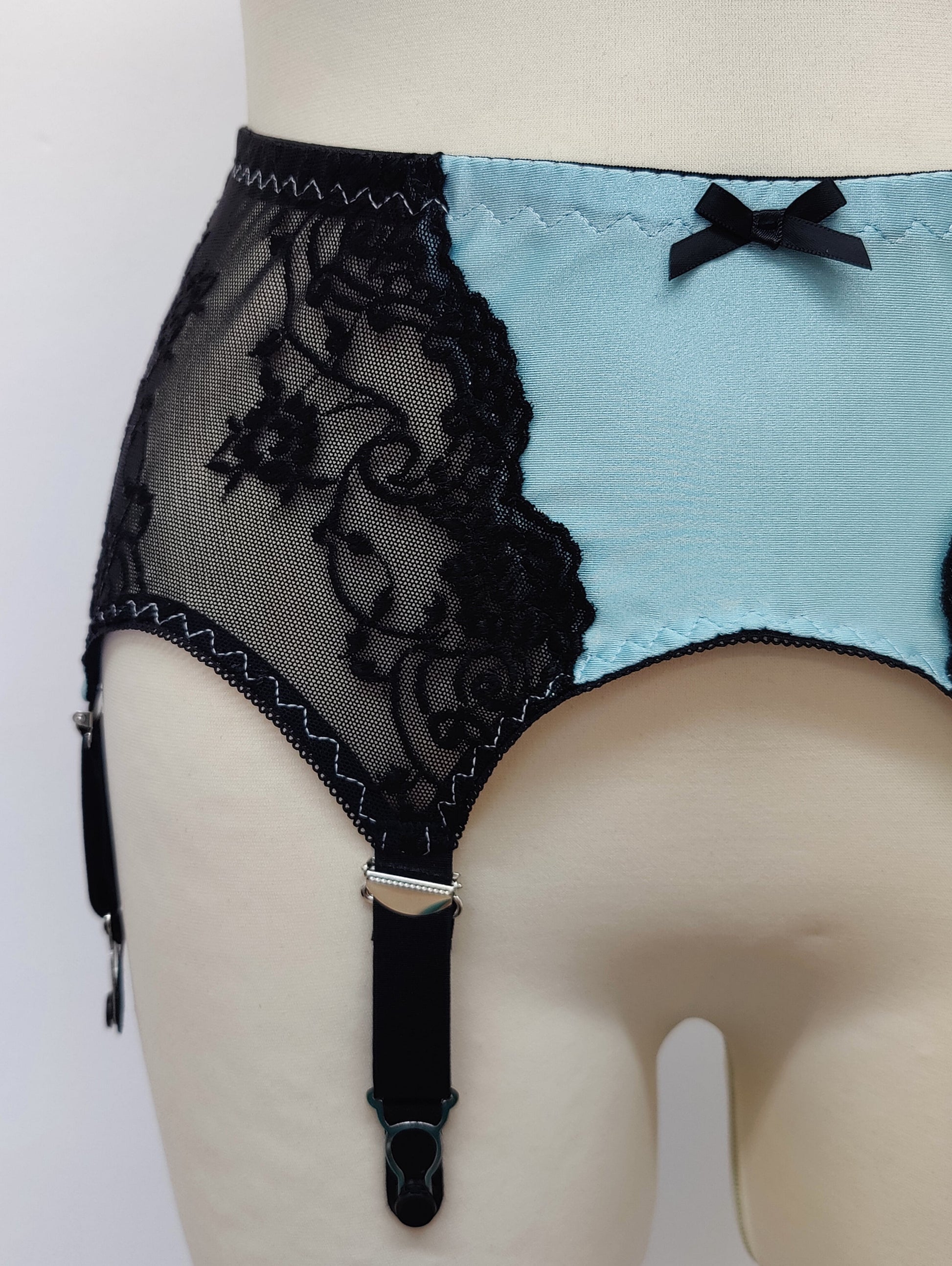 baby blue high waist retro style Mona garter belt with black lace side panels and 6 straps