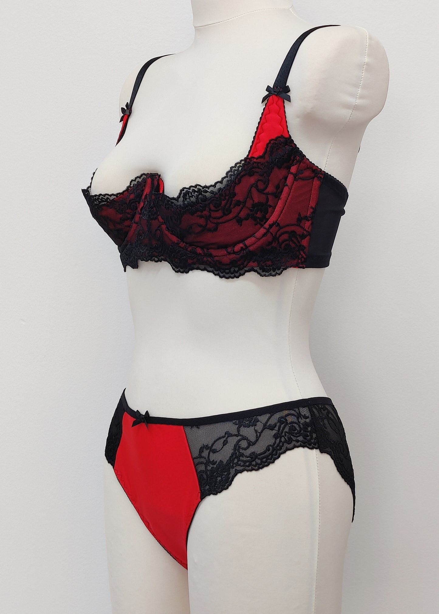red with black lace quarter cup Lucrezia bra, shown with matching panties
