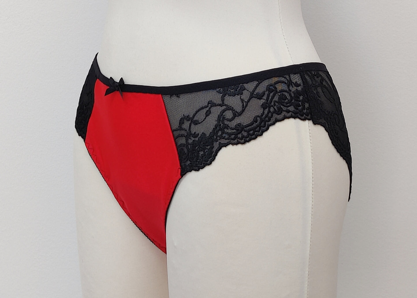 red tanga panties/knickers with black lace side inserts, side view
