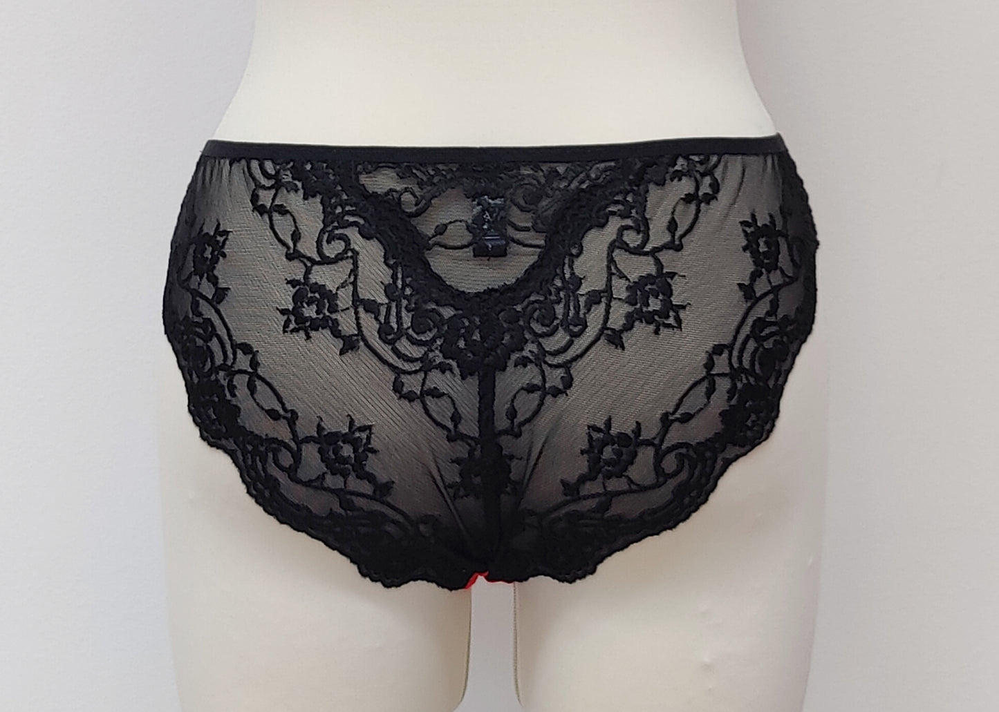 black bikini style Zigi panties with side and back lace panels, back view