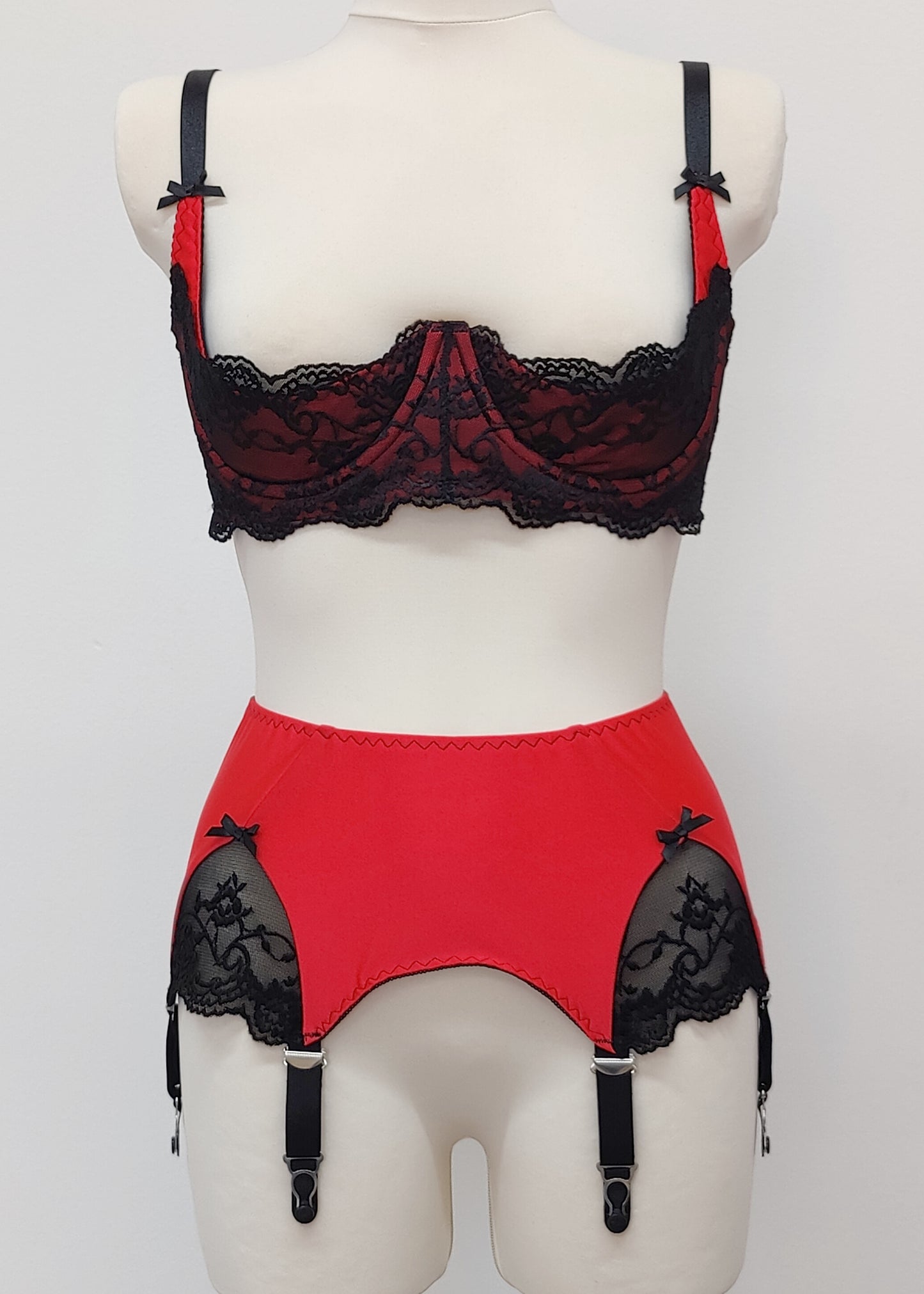 red 6 strap Scarlett garter belt with black straps and lace side inserts, shown with matching Lucrezia quarter cup bra