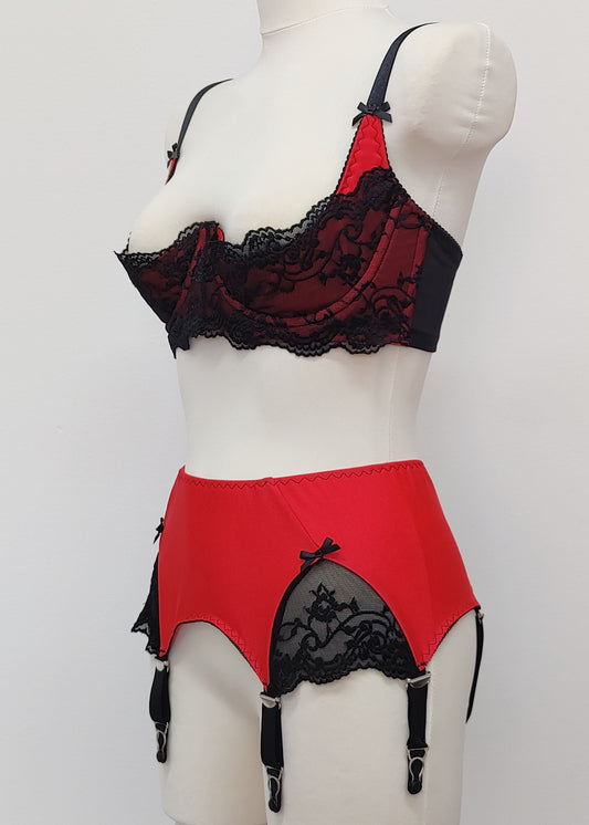 red 6 strap Scarlett garter belt with black straps and lace side inserts, shown with matching Lucrezia quarter cup bra, side view