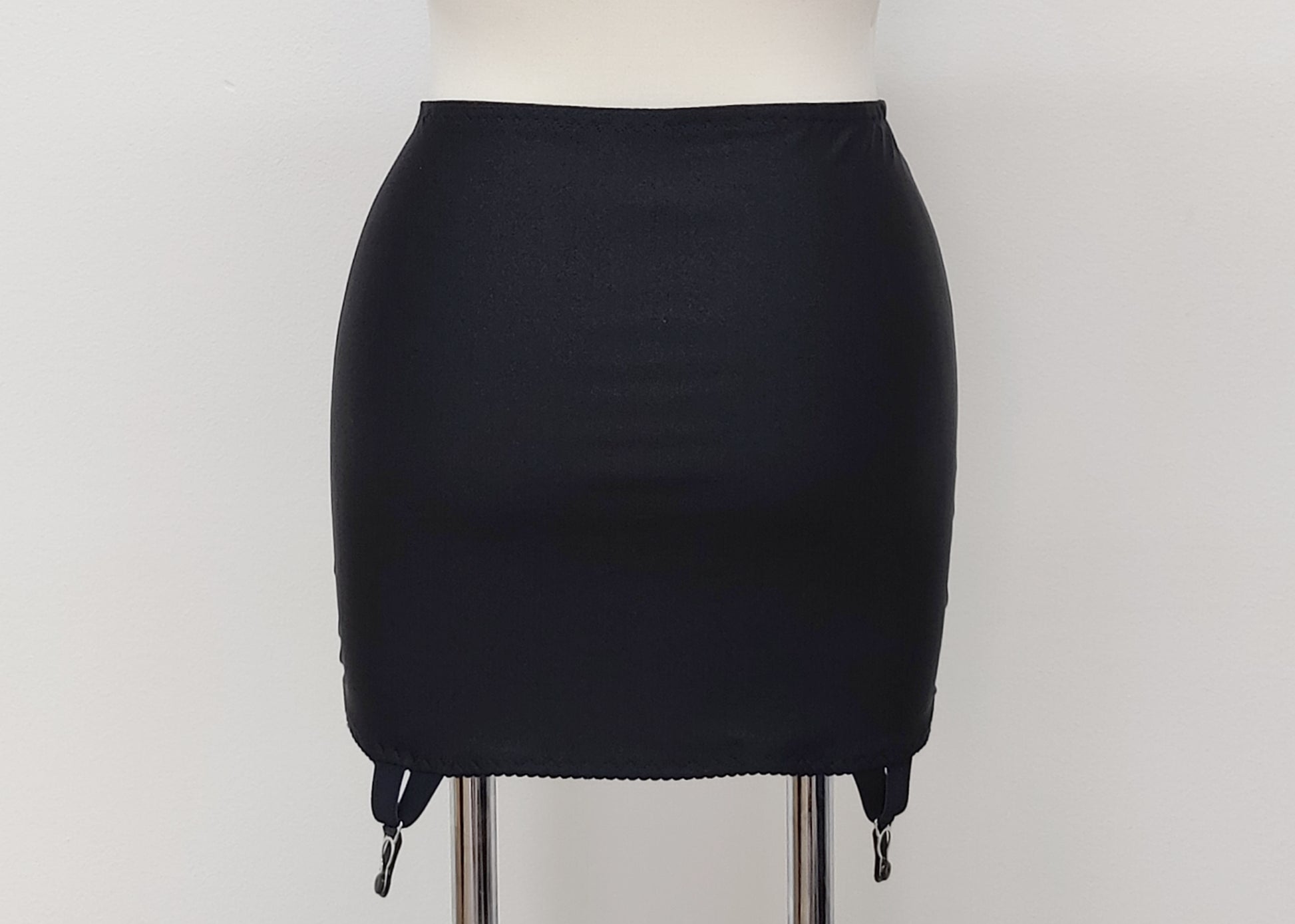black 6 strap Rhonda open bottom girdle with silvery lace trim on the front, back view