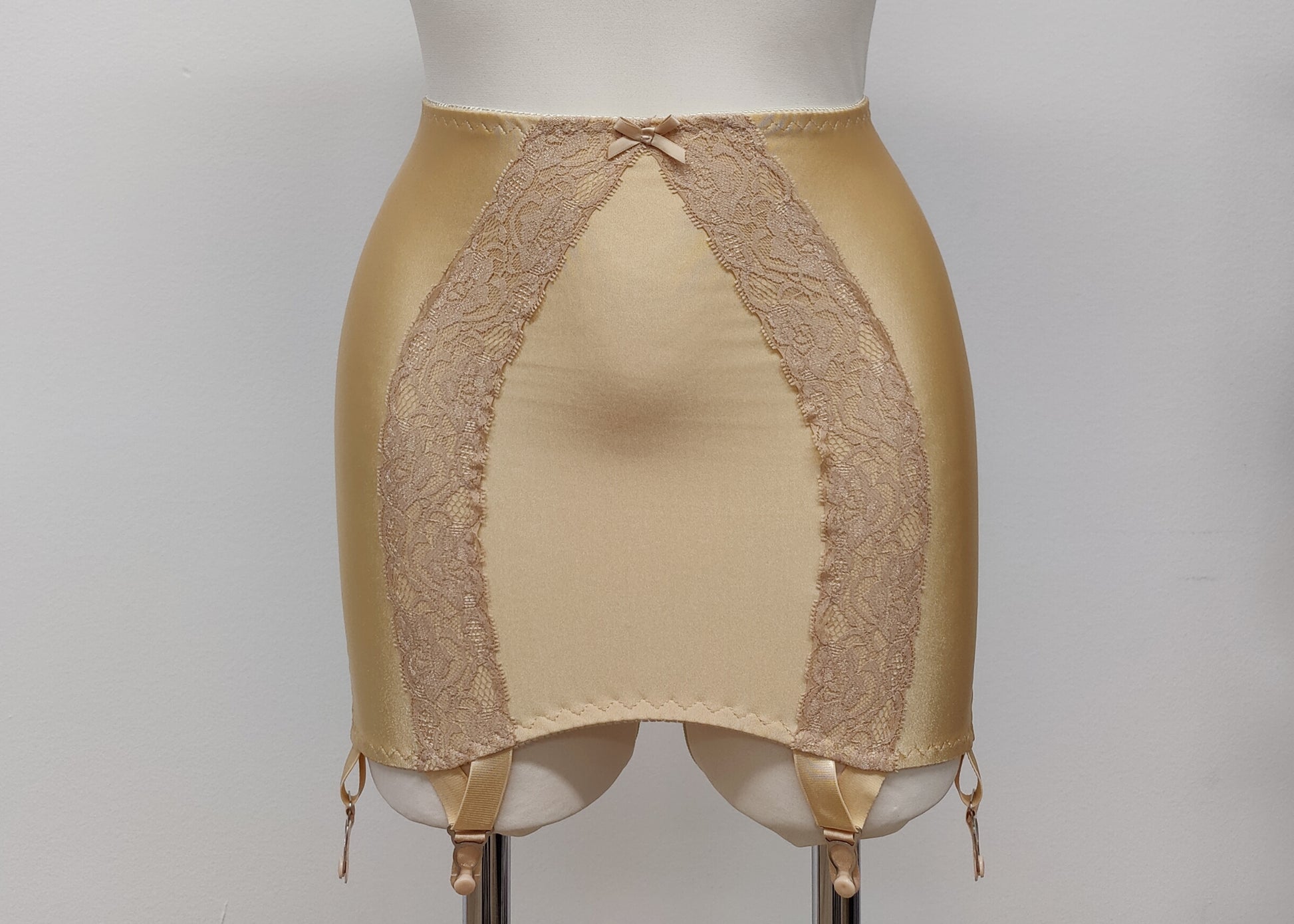 beige 6 strap Rhonda open bottom girdle, with sheer back and lace trim on the front