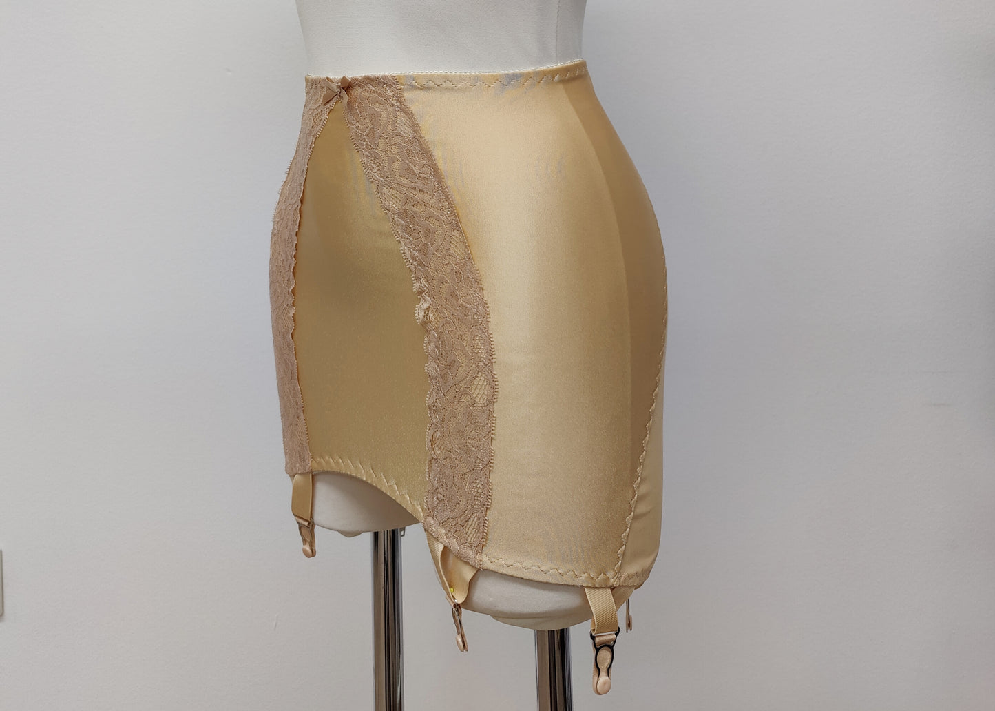 beige 6 strap Rhonda open bottom girdle, with sheer back and lace trim on the front, side view