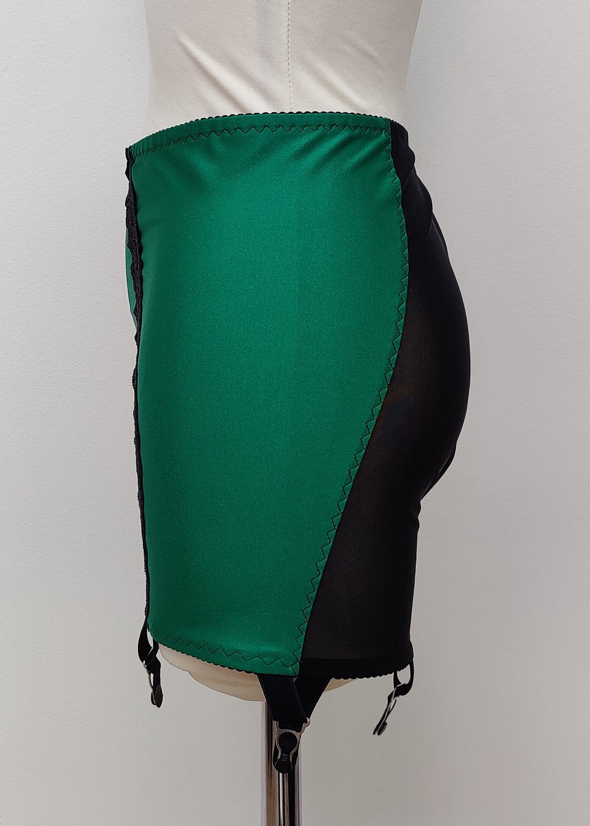 green with black, 6 strap Rhonda open bottom girdle, with sheer back and silvery lace trim on the front, side view