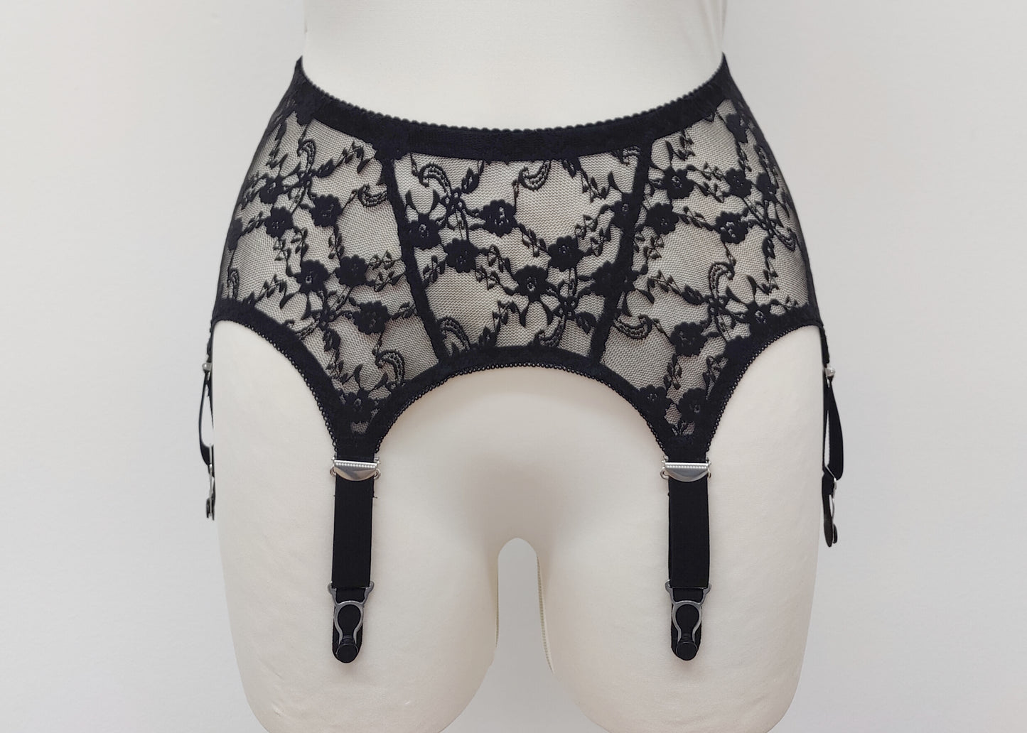 Claire is a black lace garter belt with 4-8 adjustable straps