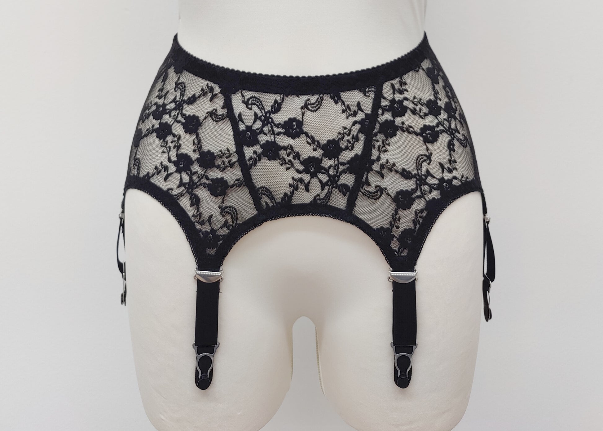 Claire is a black lace garter belt with 4-8 adjustable straps