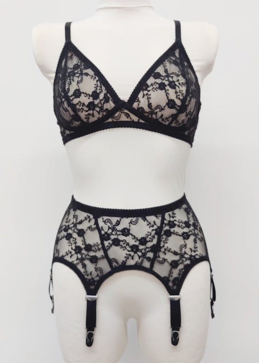 Claire is a black lace garter belt with 4-8 adjustable straps, displayed on a mannequin with matching wireless Chloe bralette