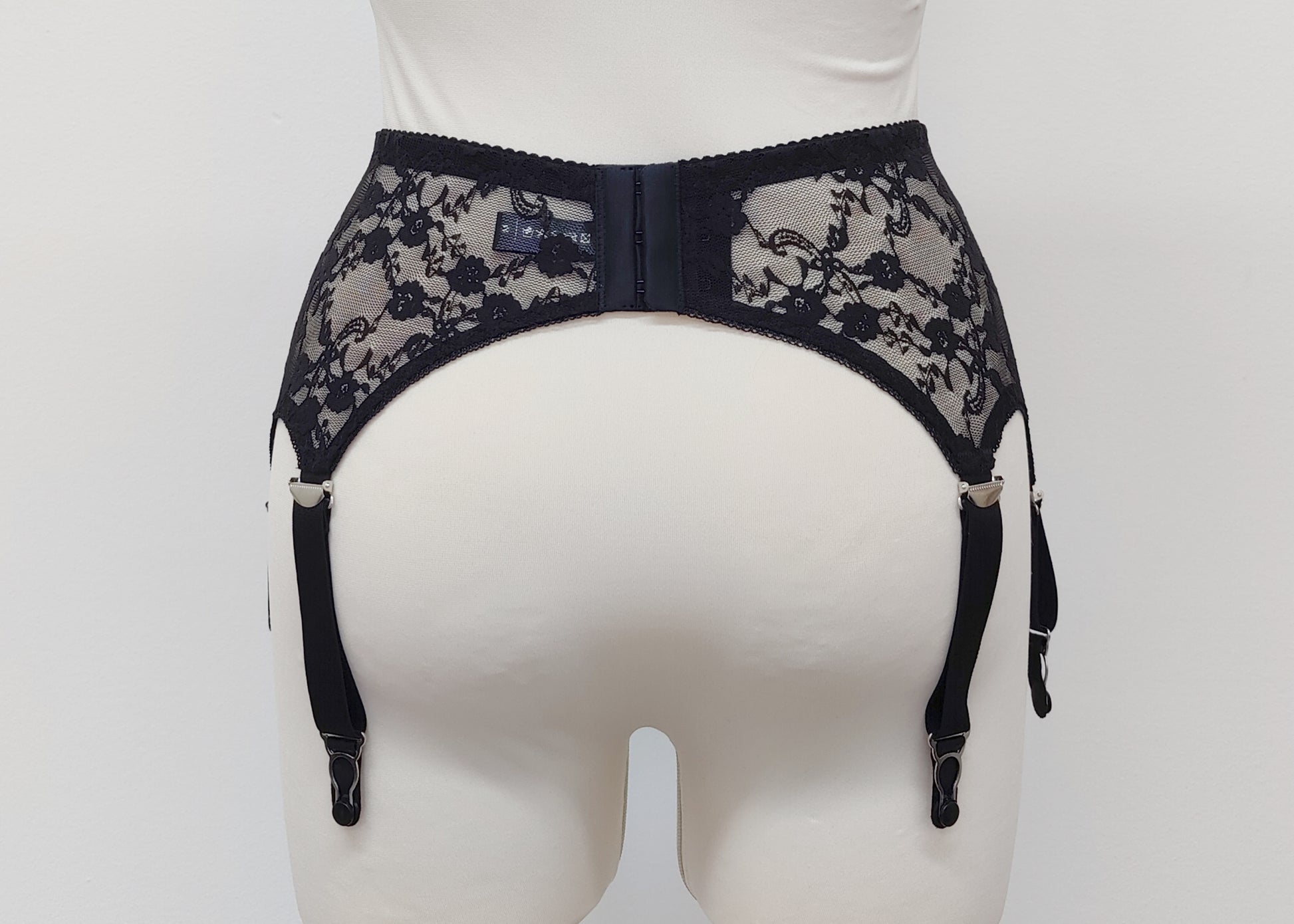 Claire is a black lace garter belt with 4-8 adjustable straps, back view