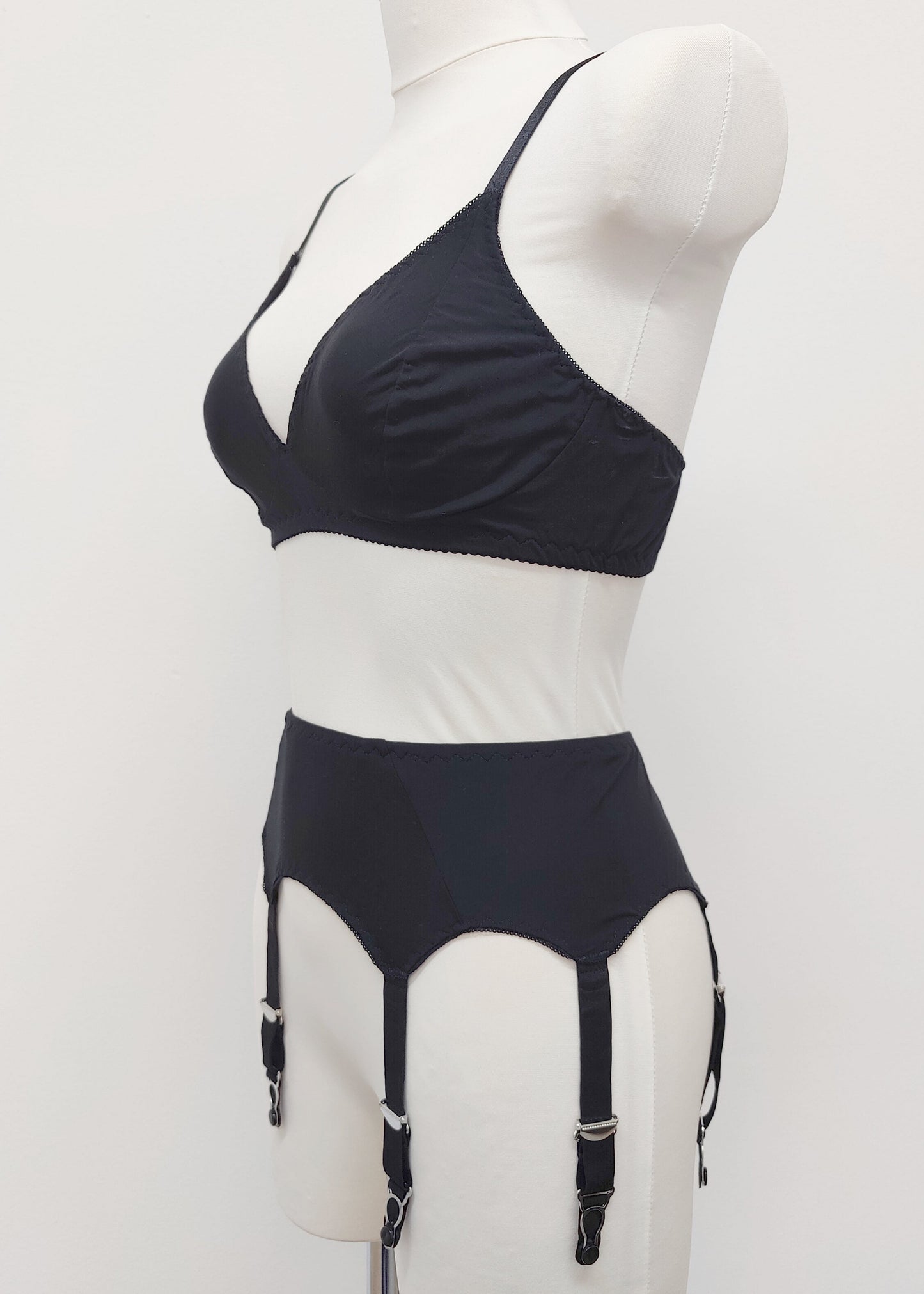 black retro style Dora suspender belt made with cotton jersey, with 6 adjustable straps, here shown with matching bralette, side view