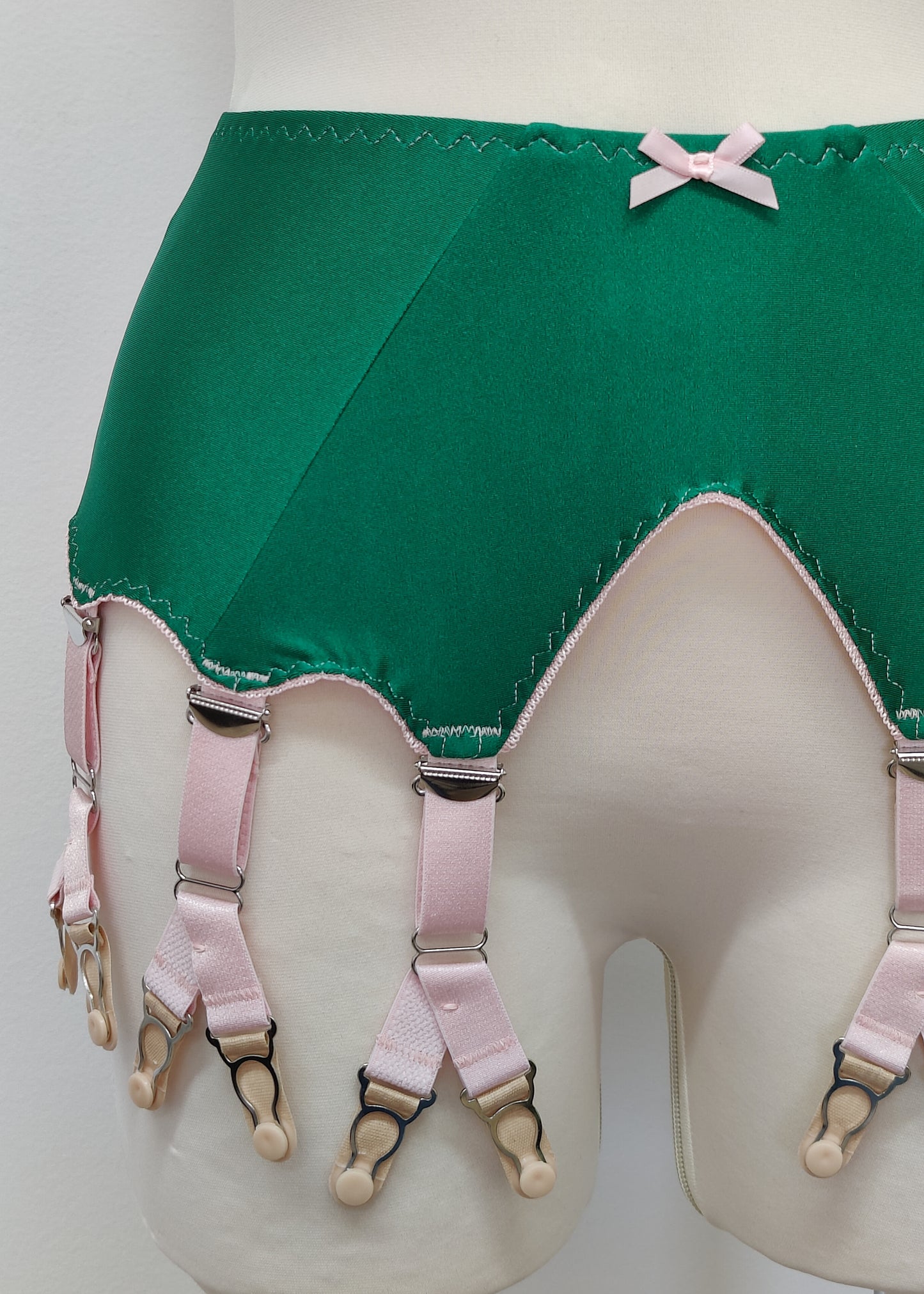 emerald green Jean garter belt with 8 pink Y-straps
