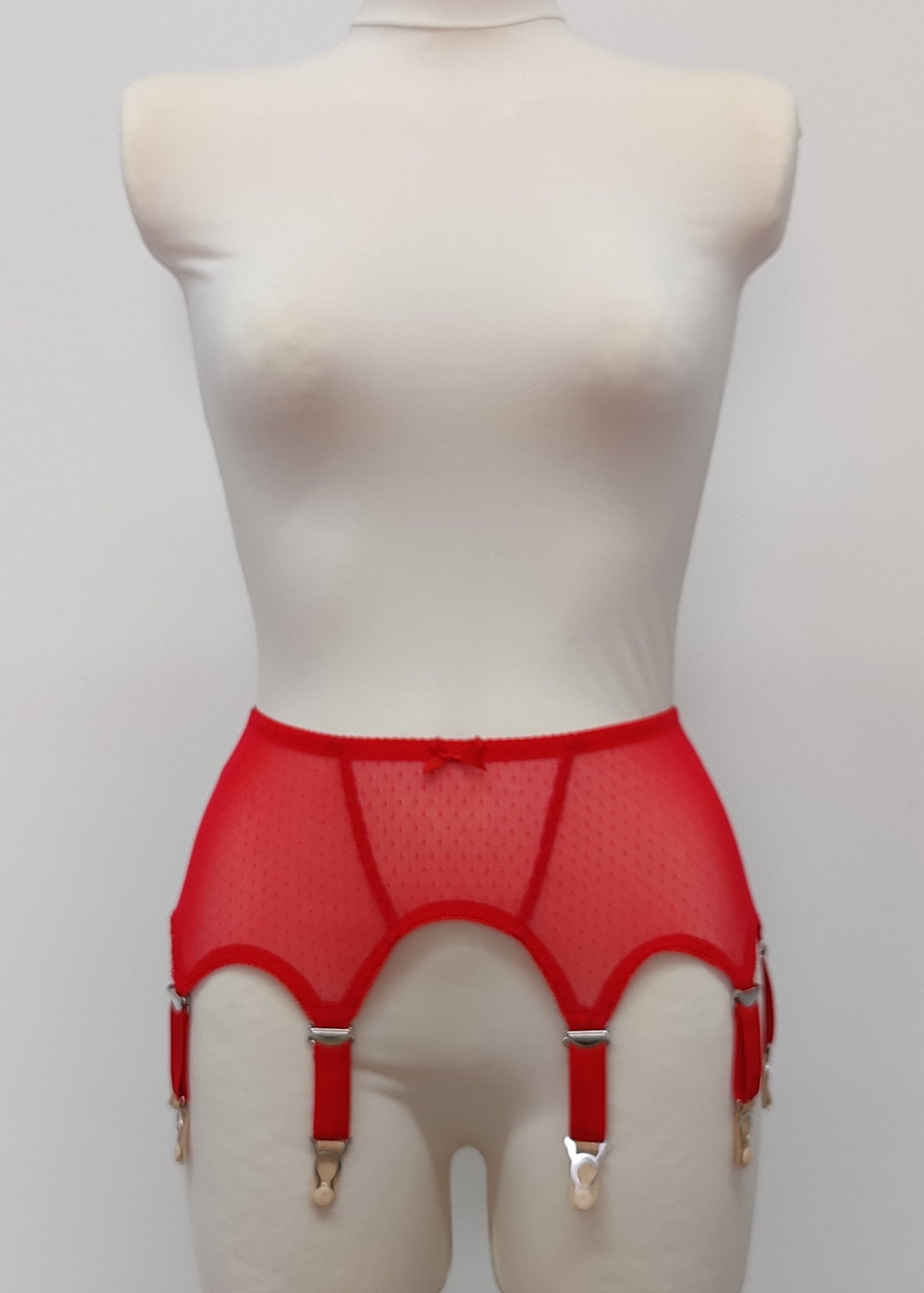 Red dot soft mesh fabric Claire garter belt with 4-8 adjustable straps, displayed on a mannequin