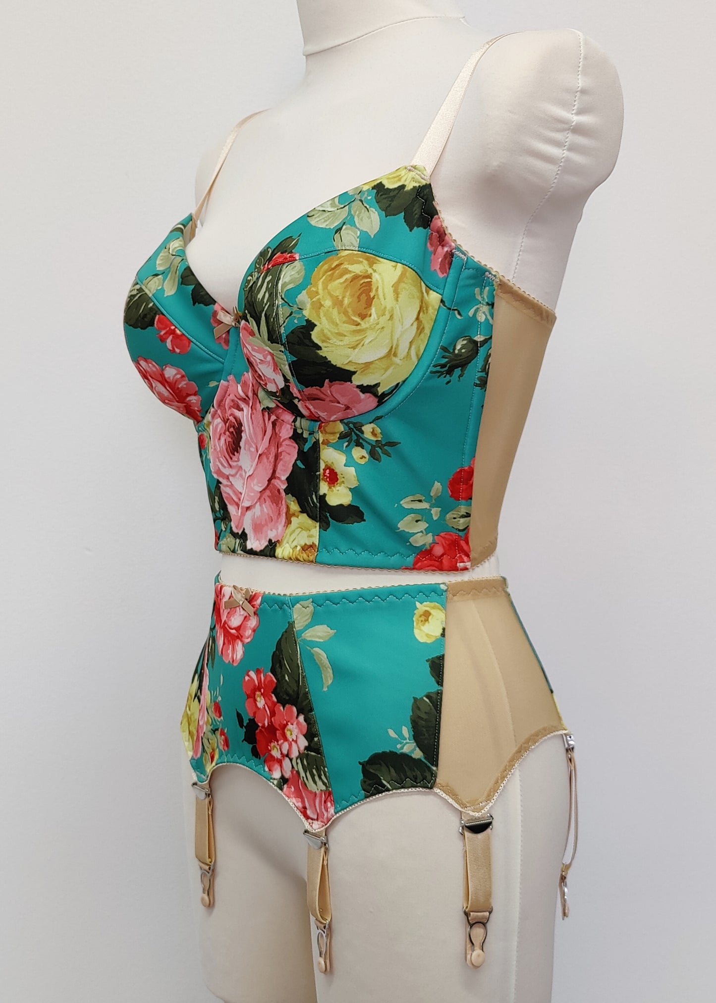 turquoise and pink floral long-line Rosie bra, shown with matching garter belt, side view