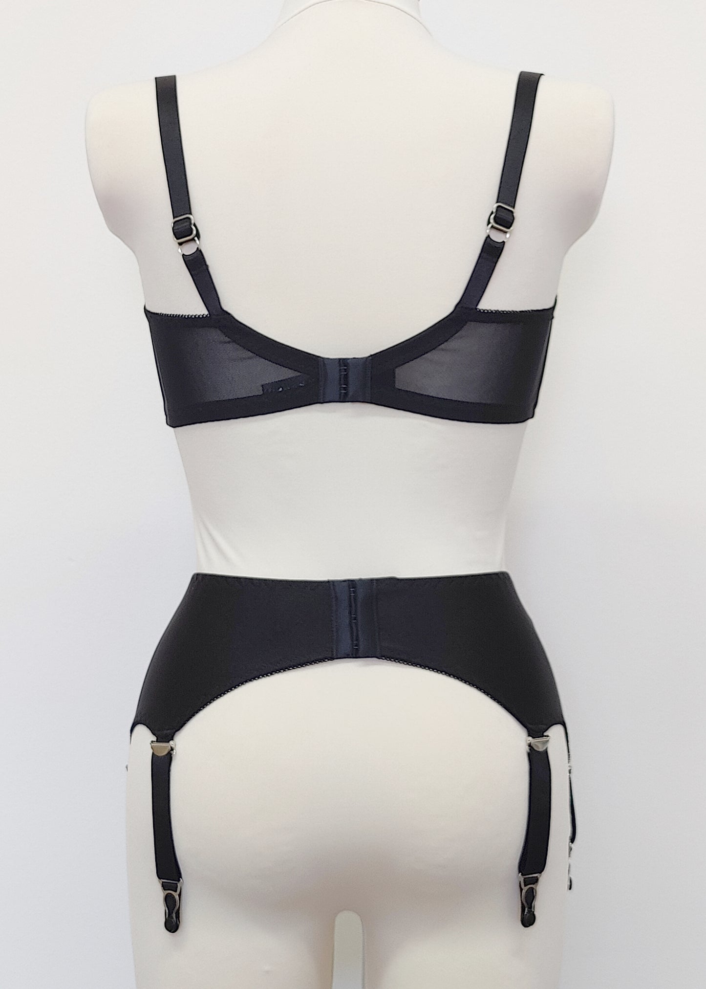 black, classic, retro style Greta garter belt with 6 straps, here shown with matching quarter cup bra, back view