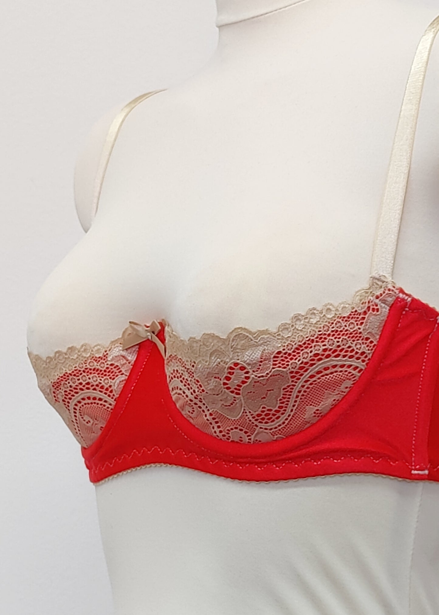 Red quarter cup Lucy bra with beige lace, straps and trims, side view