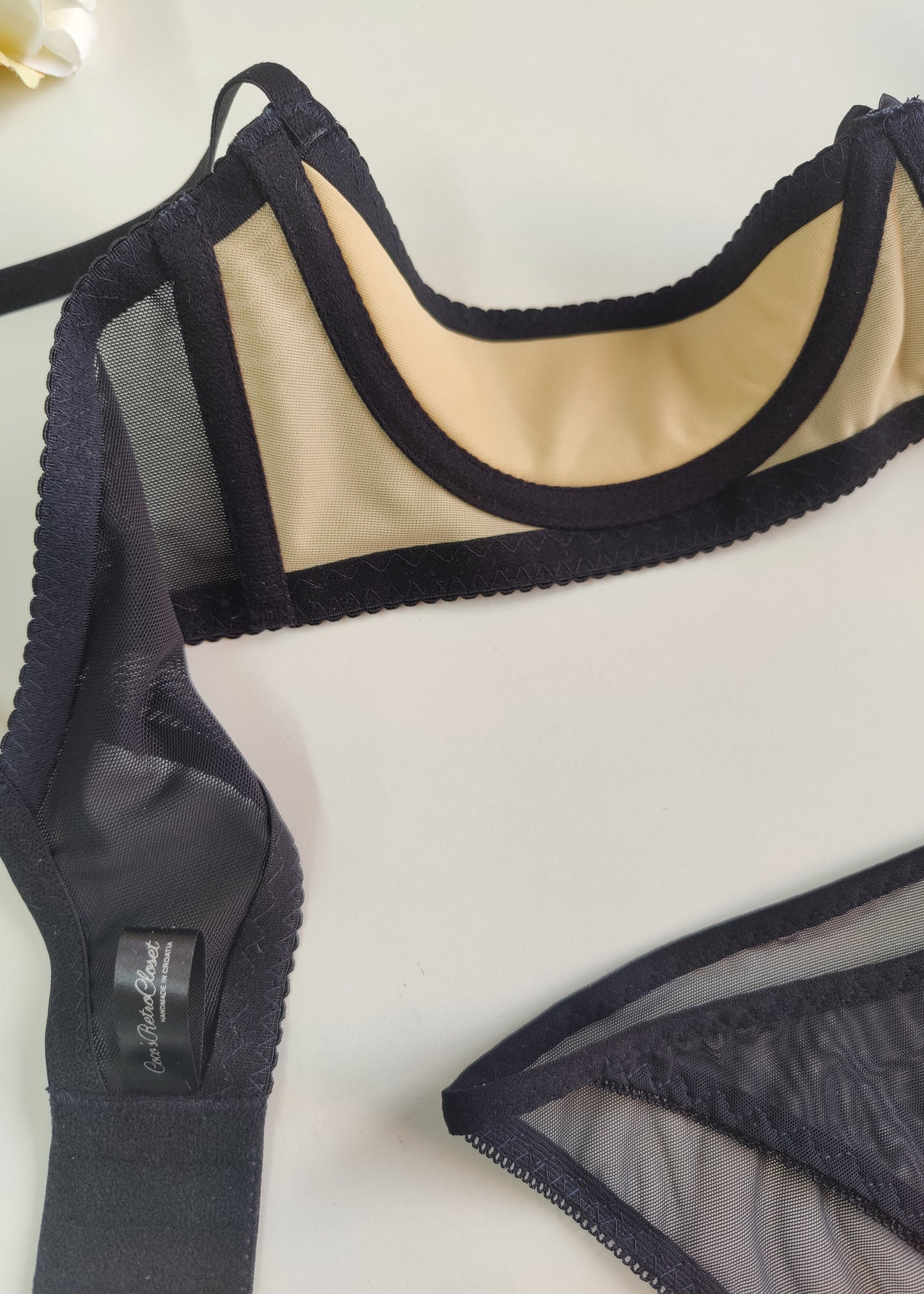 black Ella quarter cup bra made with black mesh fabric underlined with beige padding, underwired