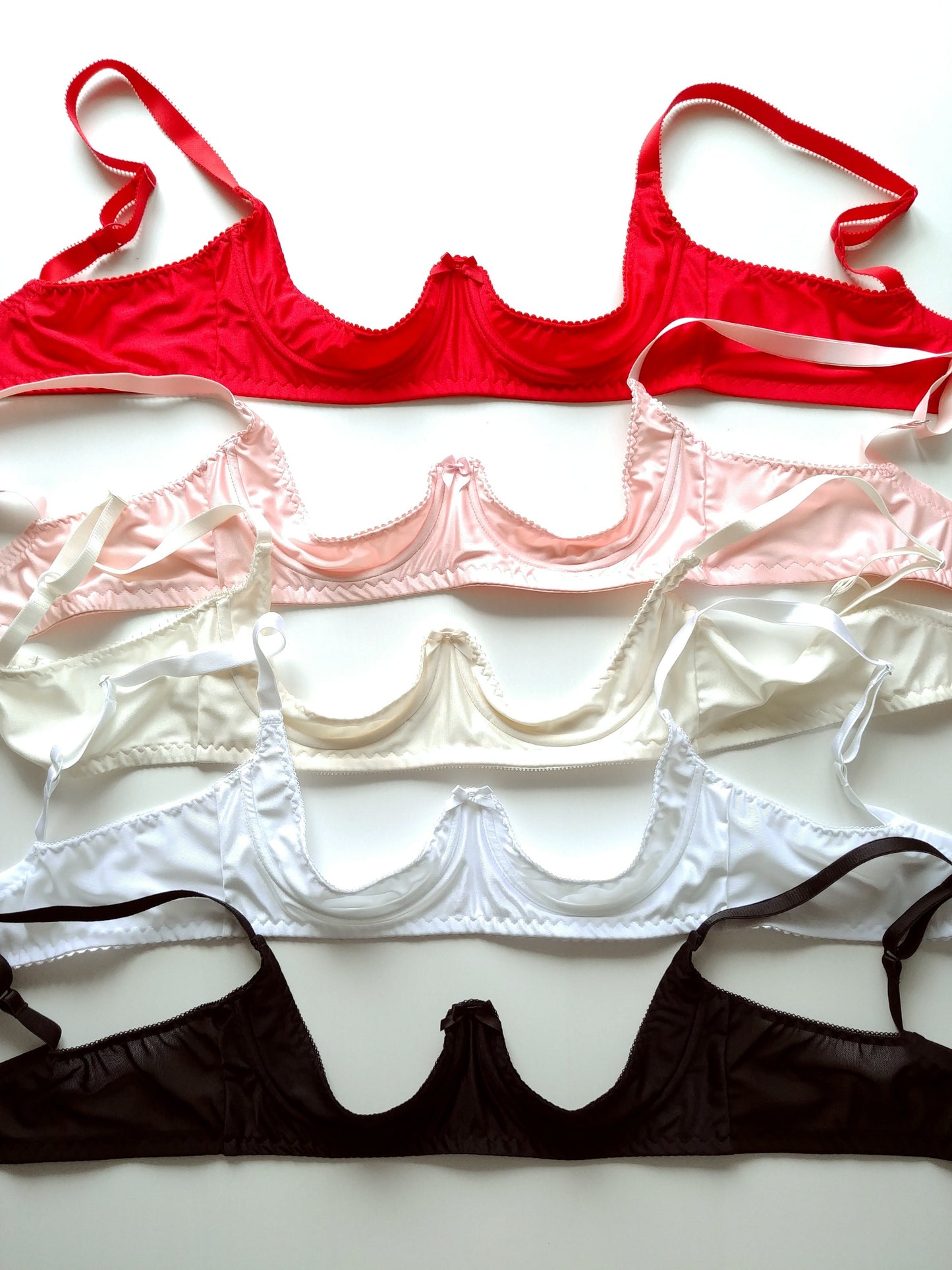 red, pink,white and black quarter cup bra
