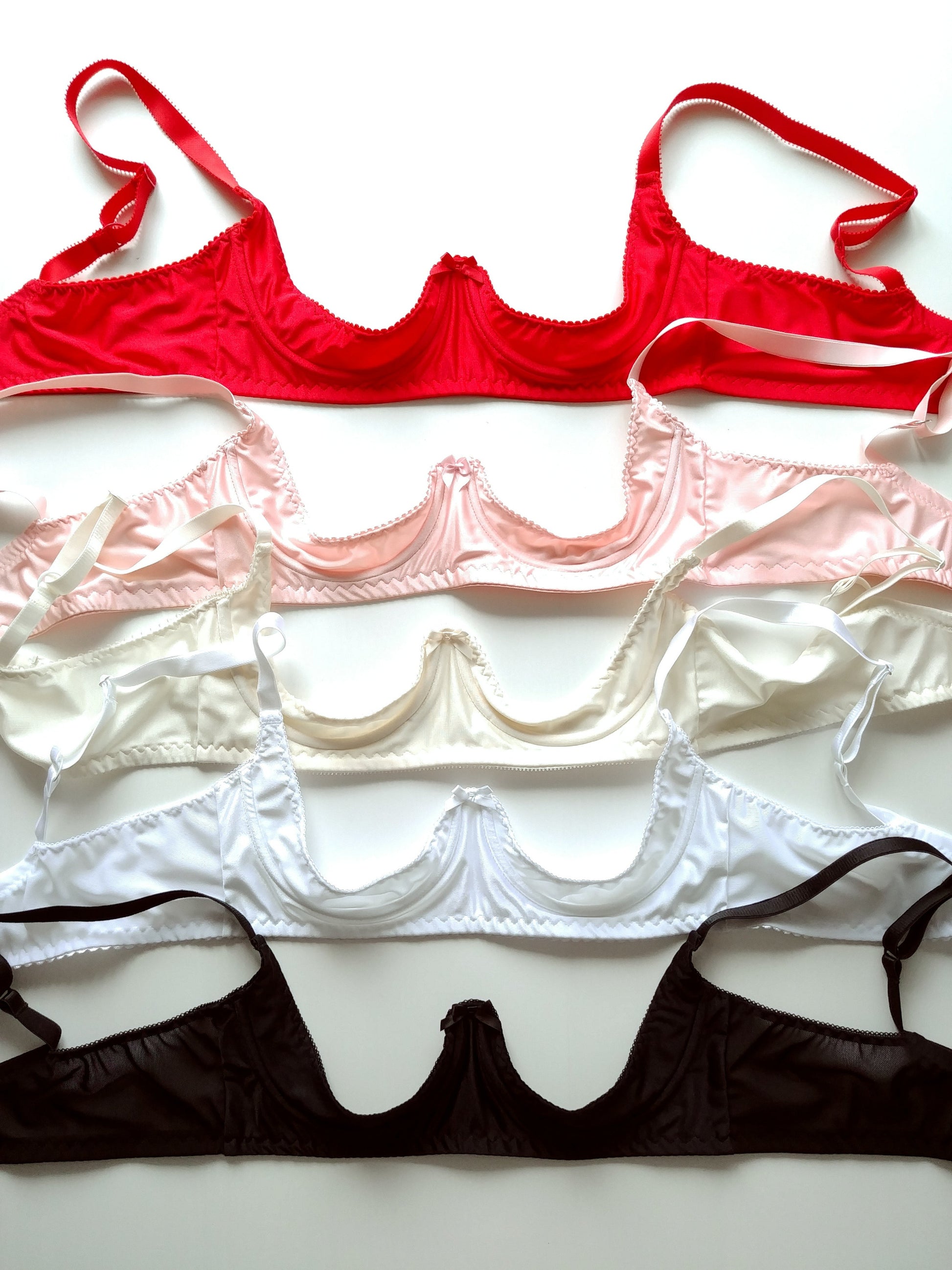 red, pink,white and black quarter cup bra