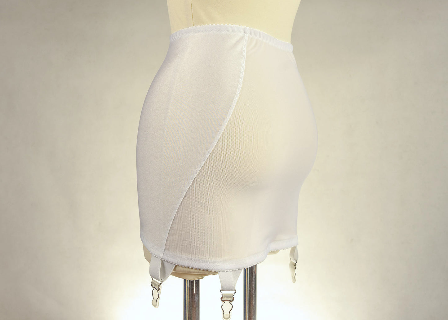 beige 6 strap Rhonda open bottom girdle, with sheer back and lace trim on the front, side view